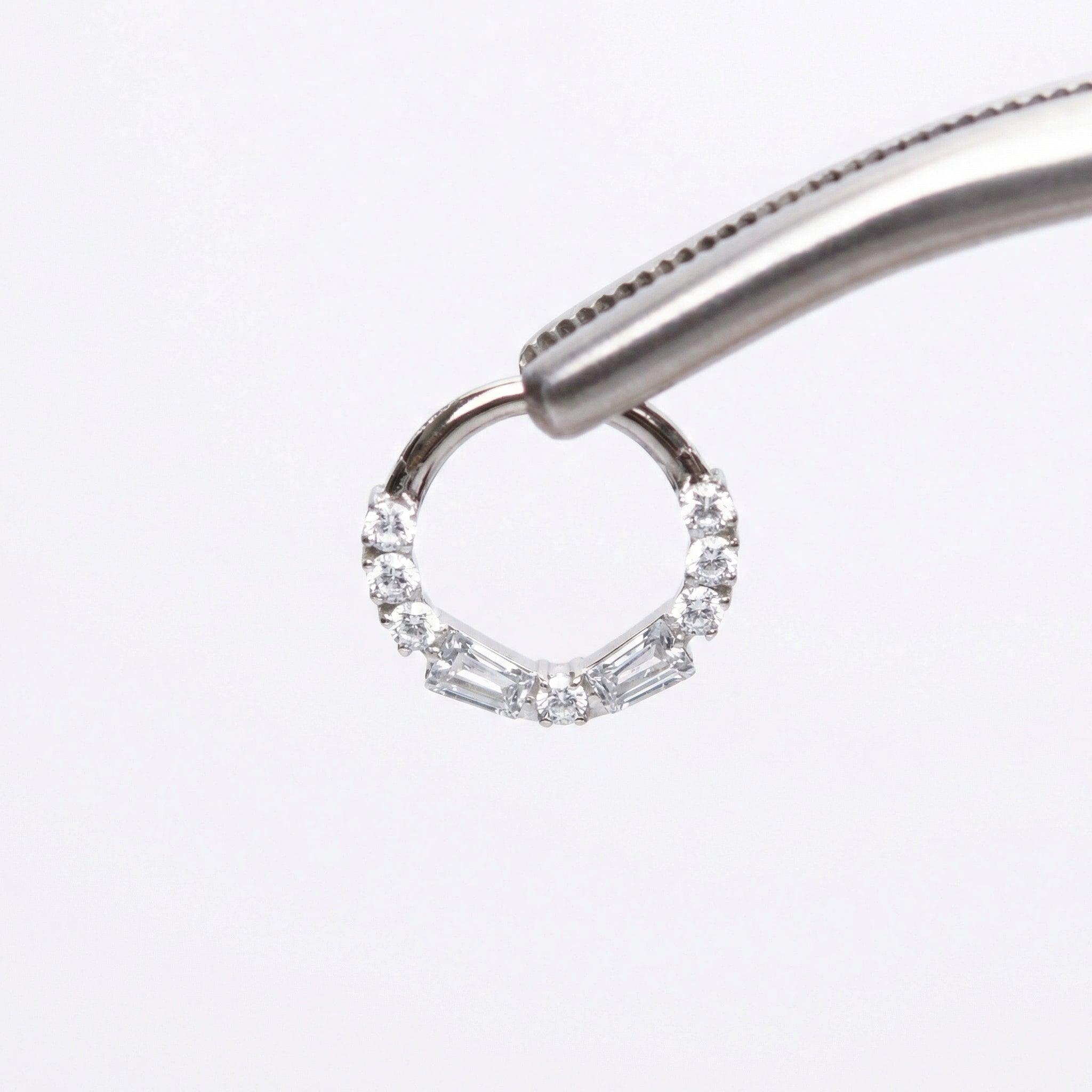 Jewelry For Daith Piercing - Piercing pliers gripping an