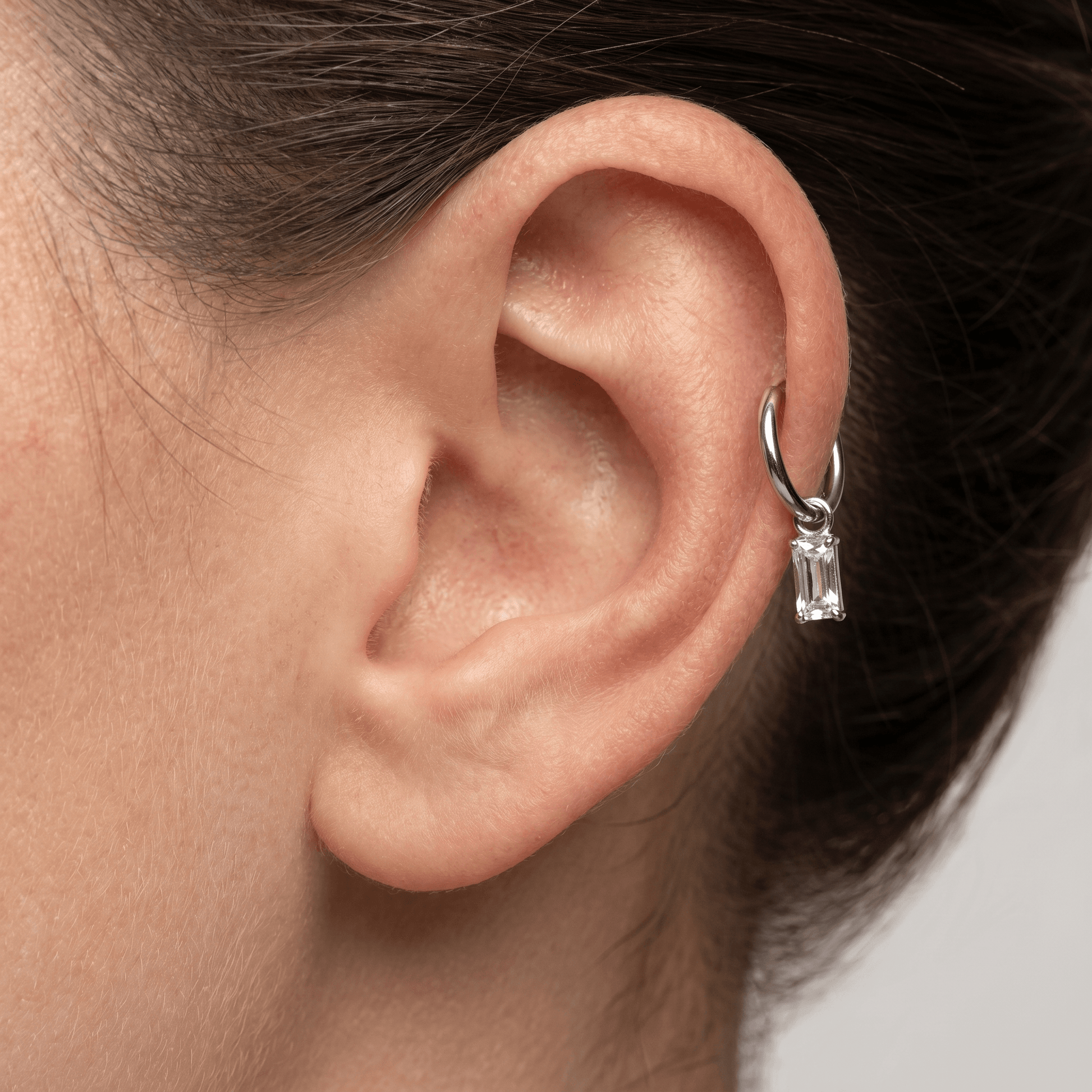 Baguette Front Helix Piercing · mid helix stud