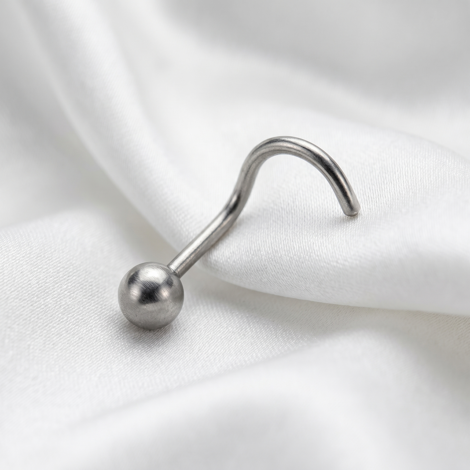 ball nose stud worn on a model — hypoallergenic titanium