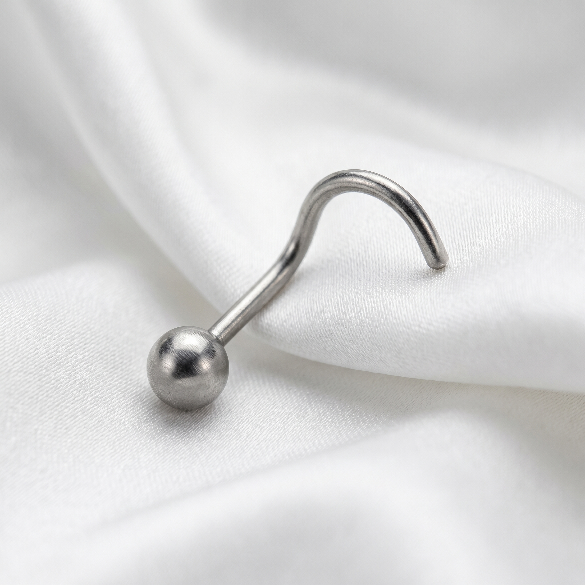 ball nose stud worn on a model — hypoallergenic titanium
