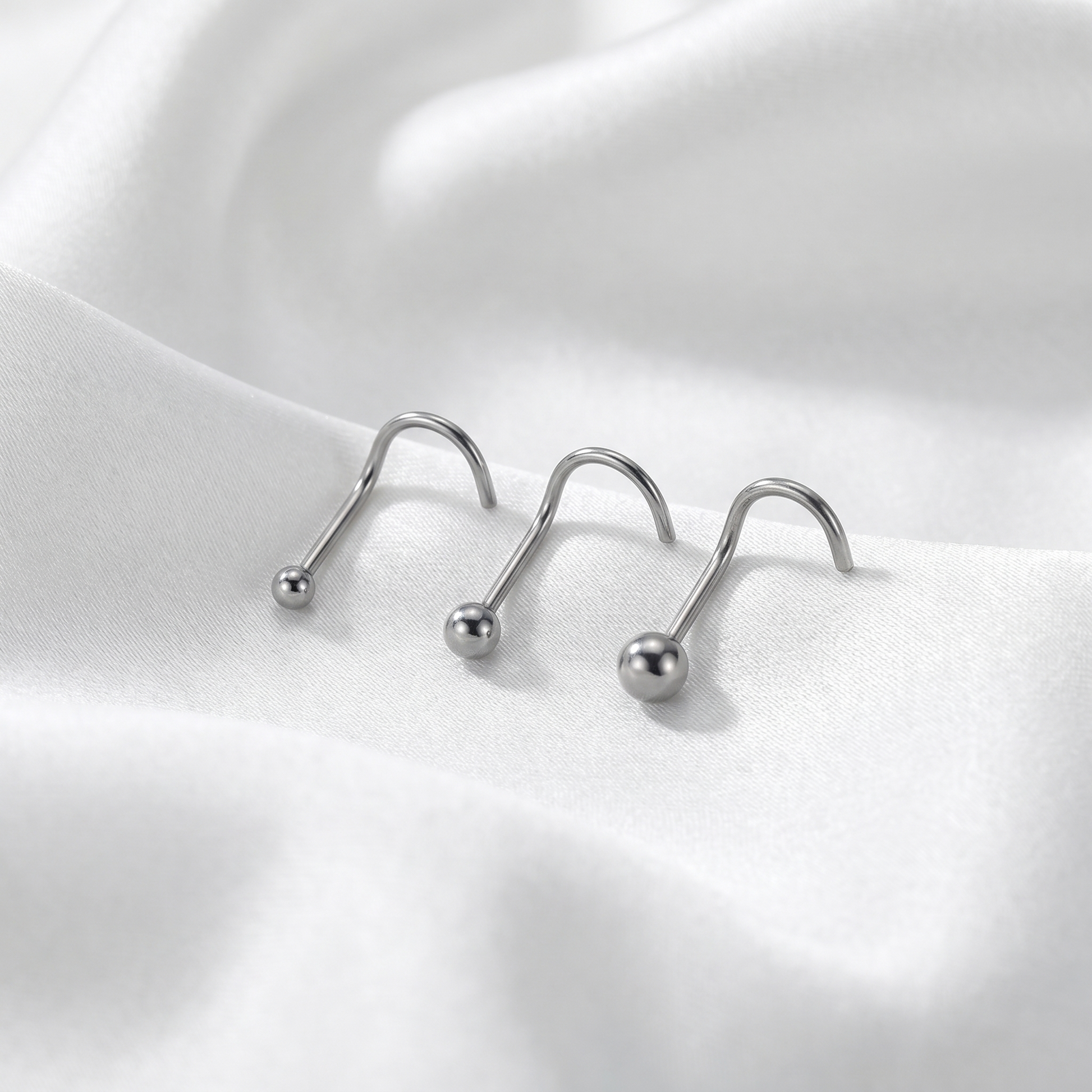 ball nose stud on satin fabric — G23 titanium 20G