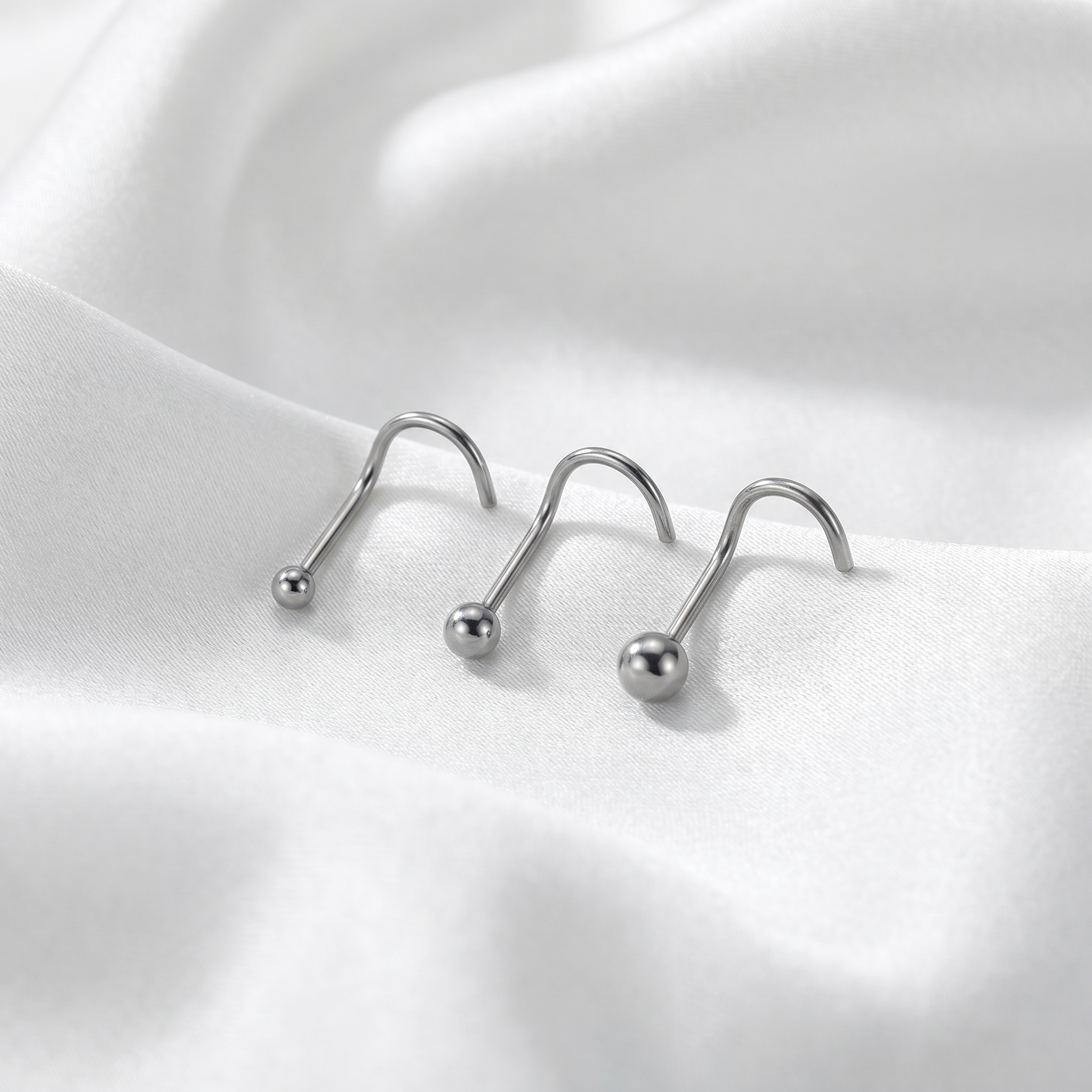ball nose stud on satin fabric — G23 titanium 20G