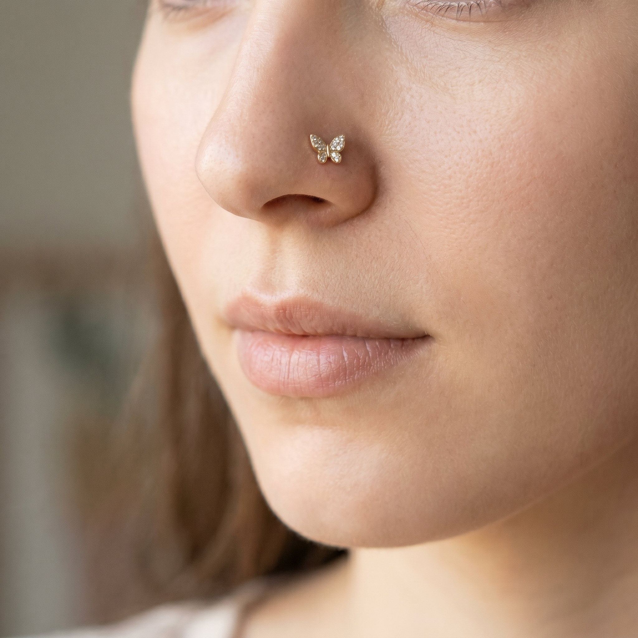 butterfly nose stud close-up on a model — single nostril nose jewelry