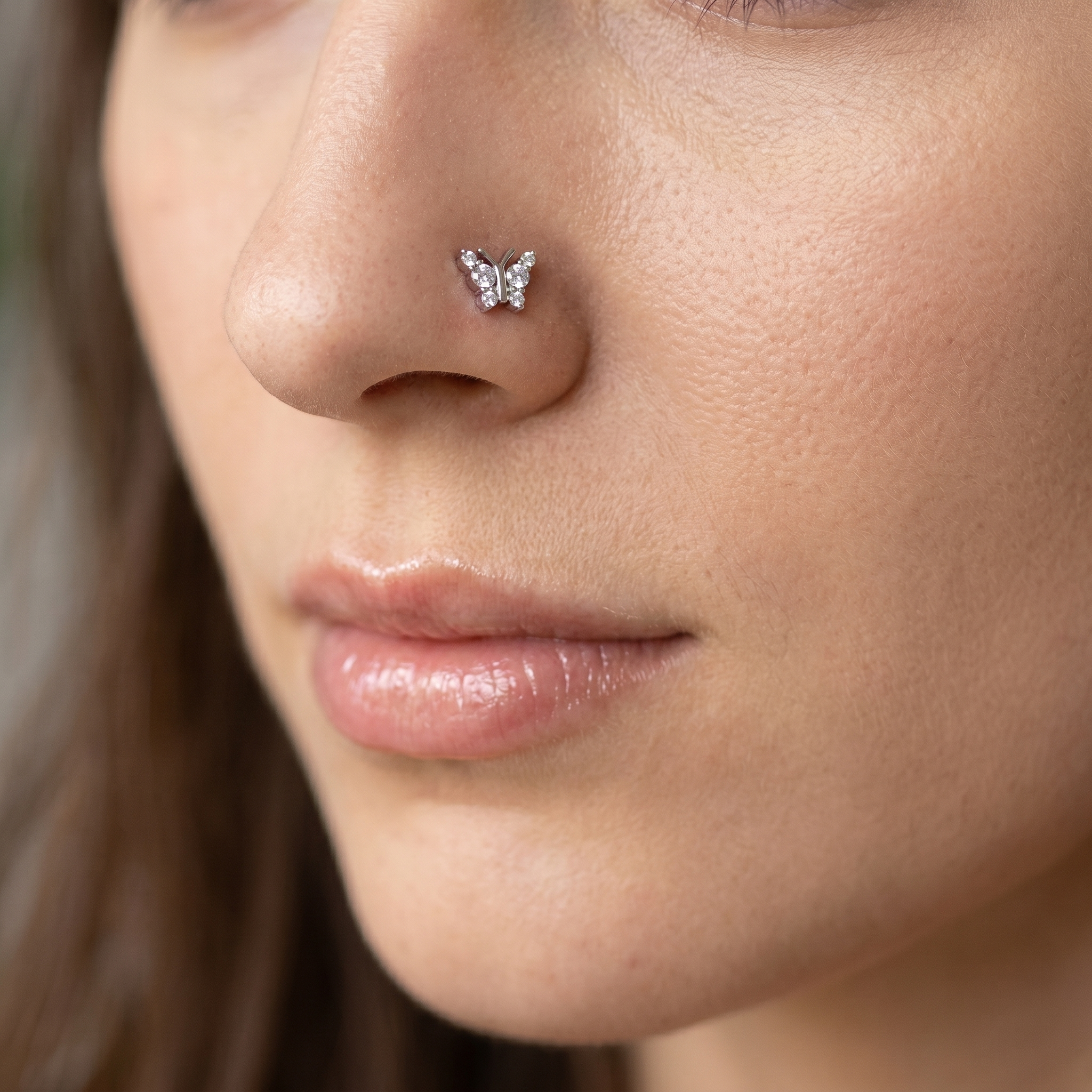 butterfly nose stud worn on a model, side profile
