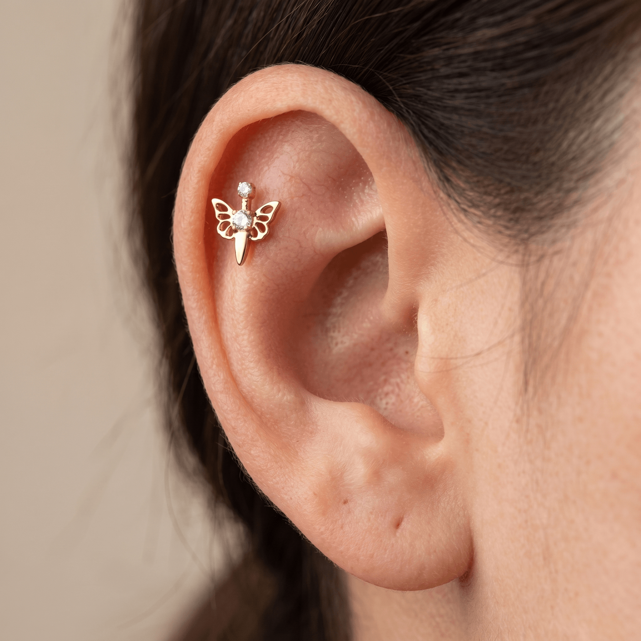 Gold butterfly zircon stud — flat helix piercing placement