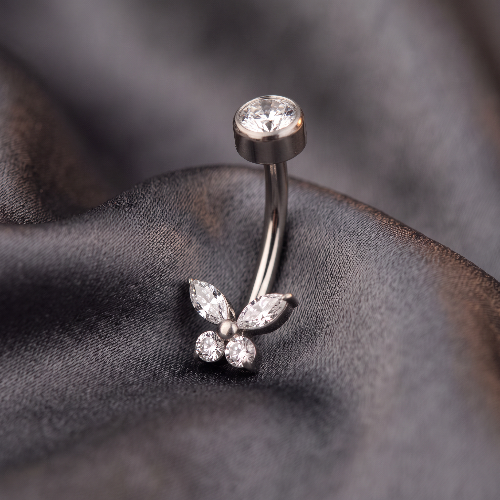 Butterfly Zircon belly button ring in silver on champagne satin — G23 titanium 14G