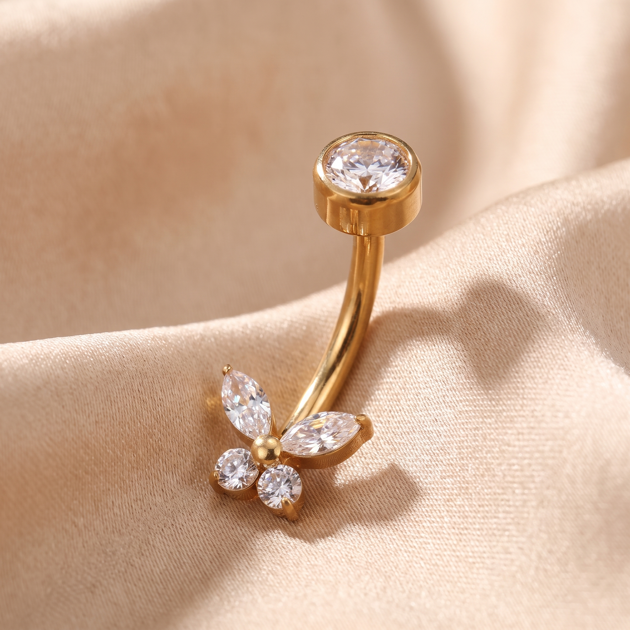 Butterfly Zircon belly button ring in gold on champagne satin — G23 titanium 14G