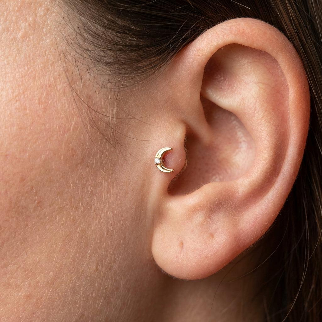 Silver crescent moon zircon stud — tragus jewelry placement