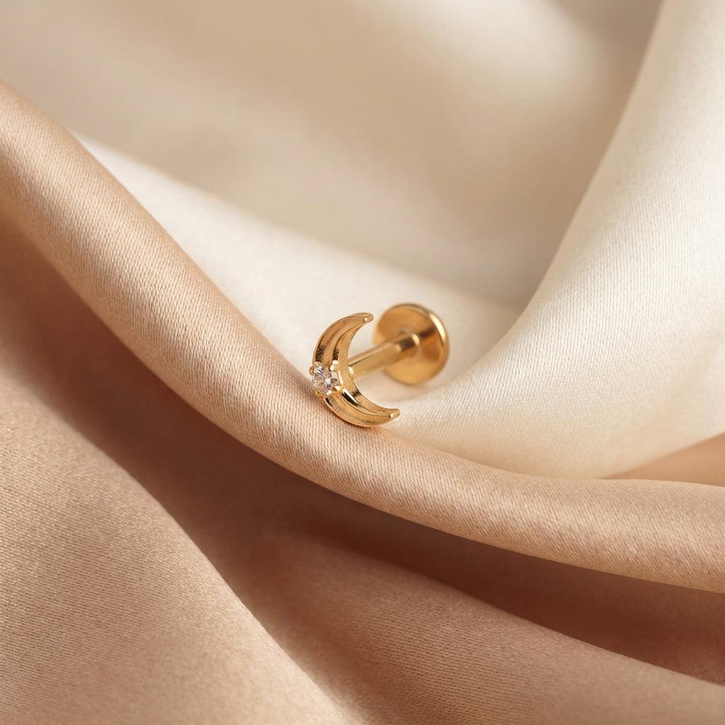Double Helix Ear Piercing - Close-up of a gold
