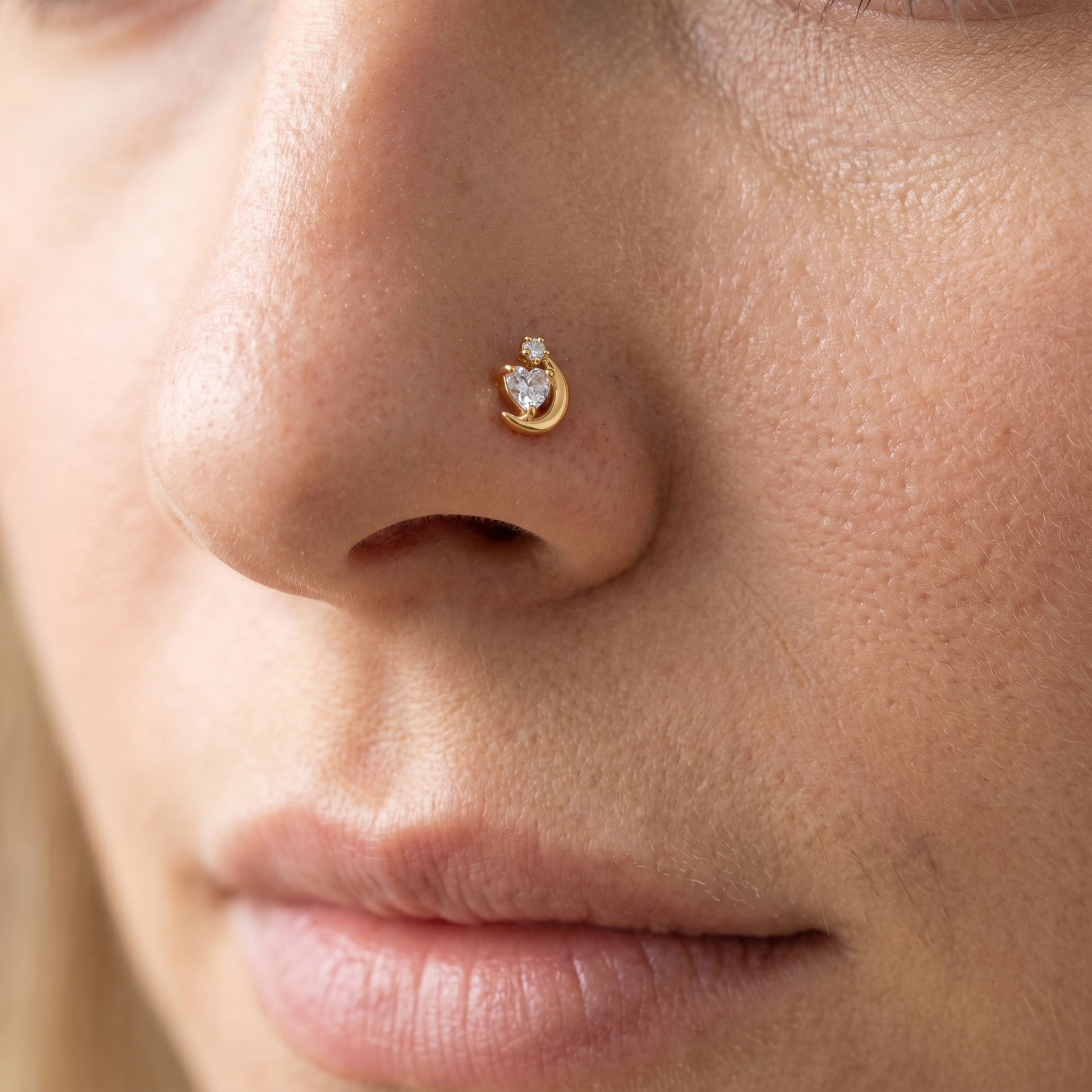 crescent moon nose stud close-up on a model — single nostril nose jewelry