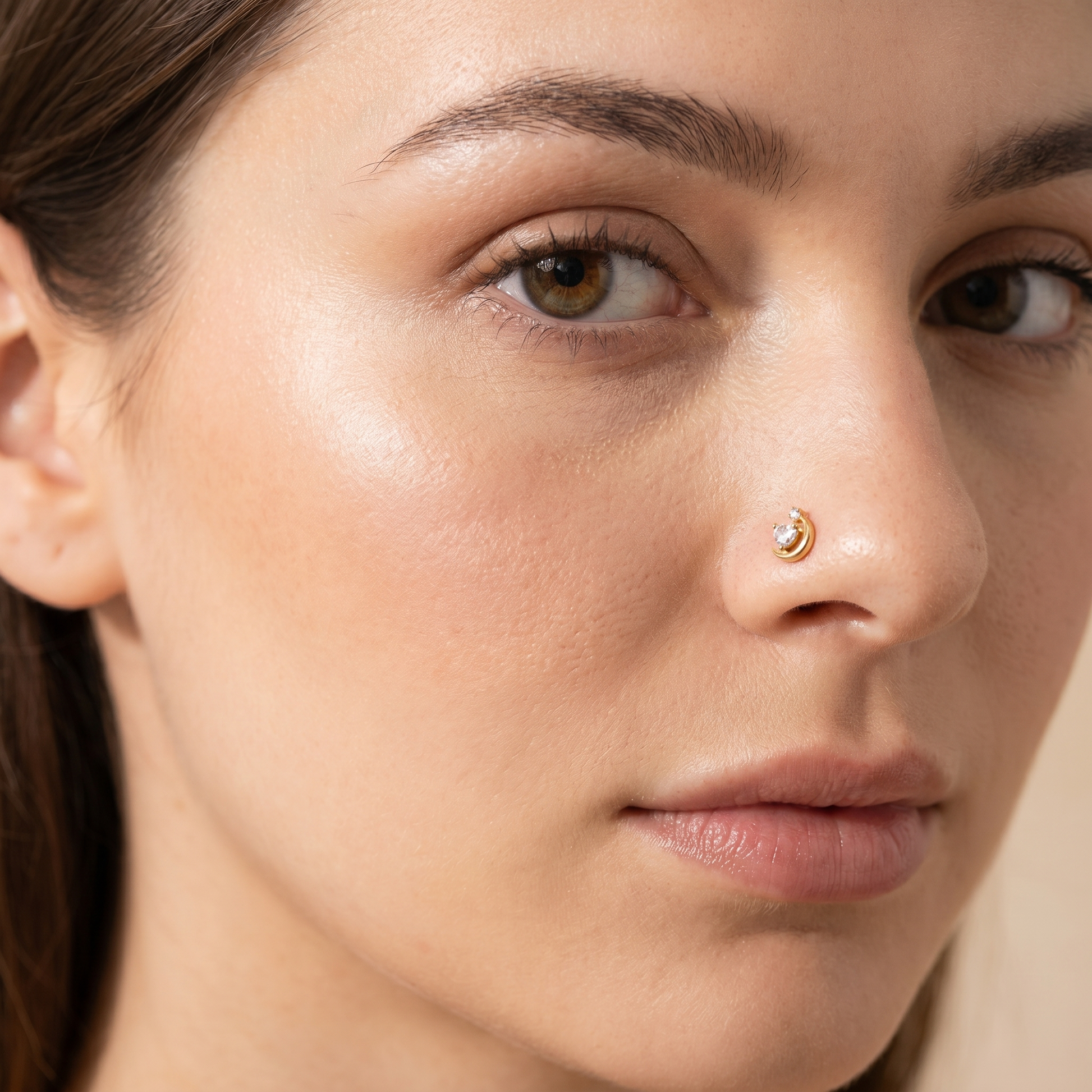 crescent moon nose stud worn on a model — hypoallergenic titanium