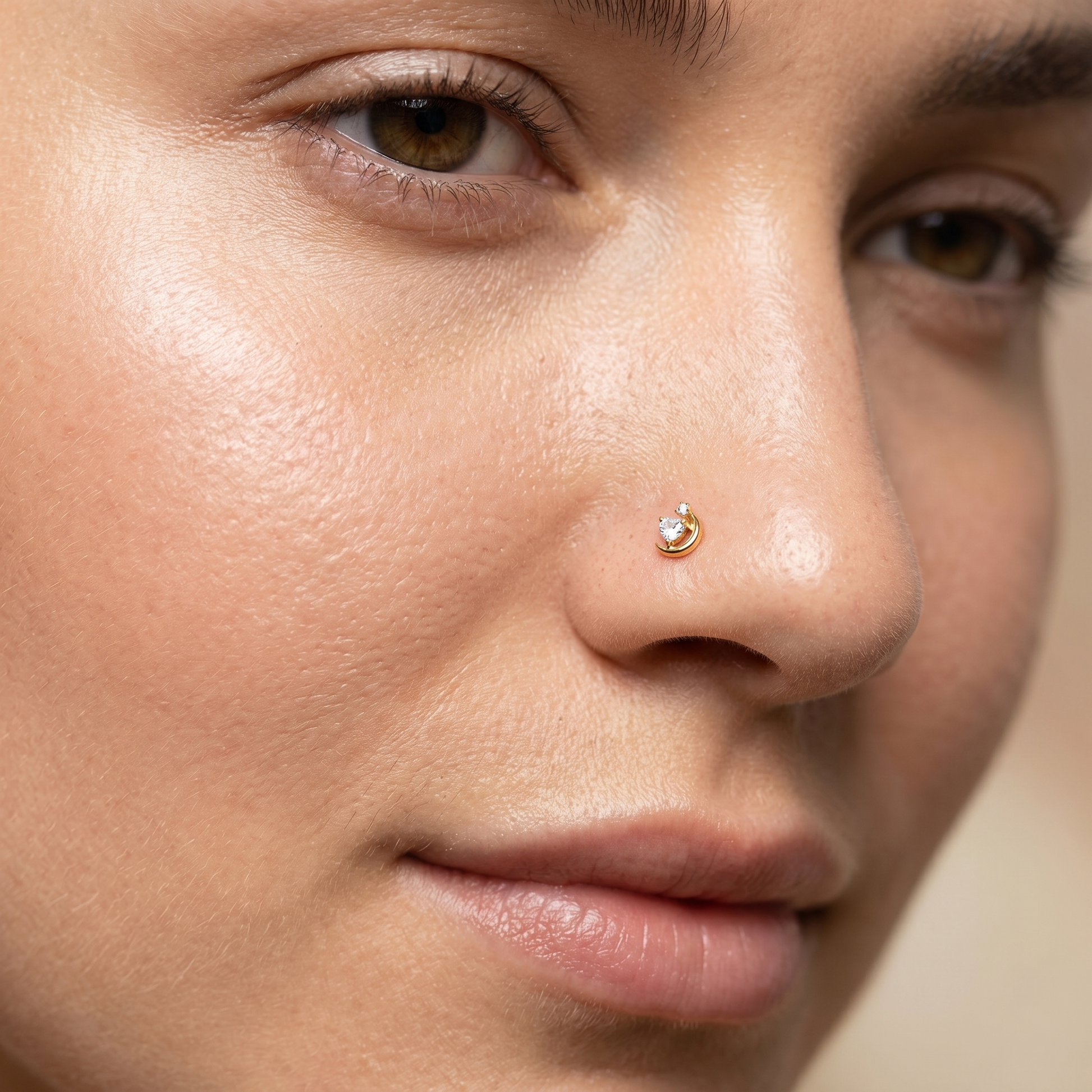 crescent moon nose stud worn on a model, side profile
