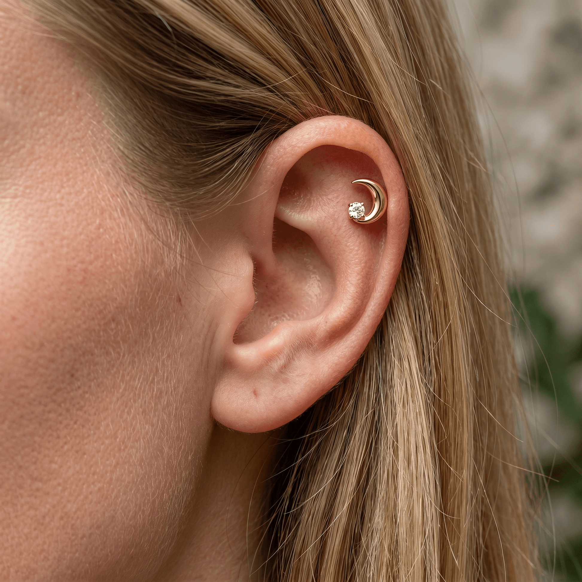 Gold medical-grade titanium piercing worn perfectly in a standard .