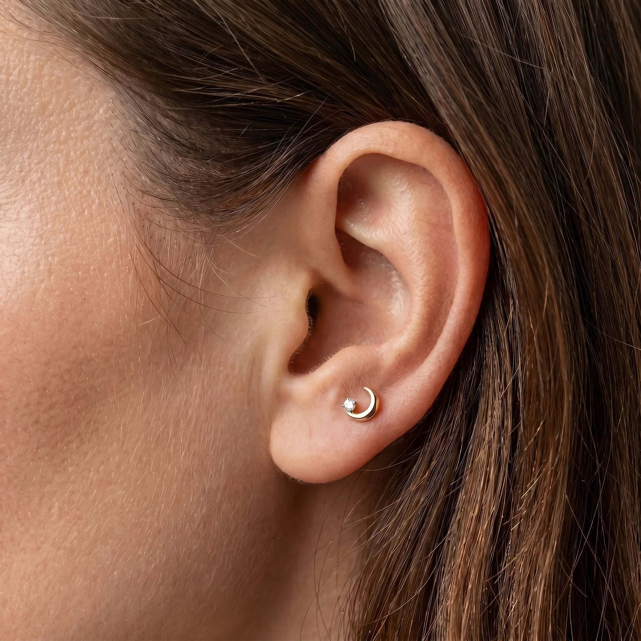 Gold medical-grade titanium piercing styled beautifully in a placement.