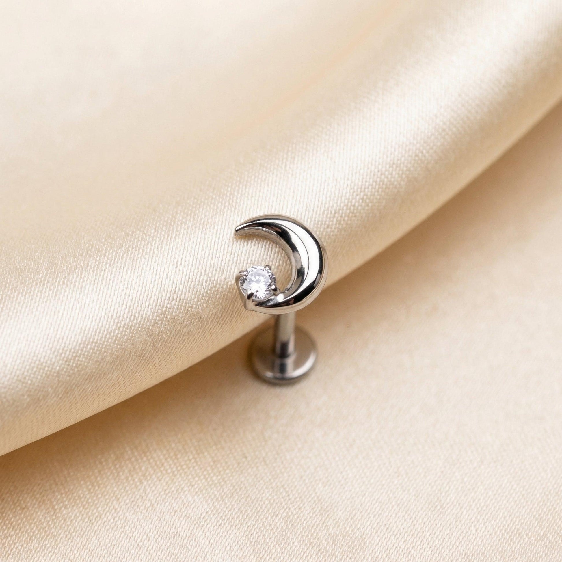 Crescent Front Helix Piercing - Silver titanium resting gracefully