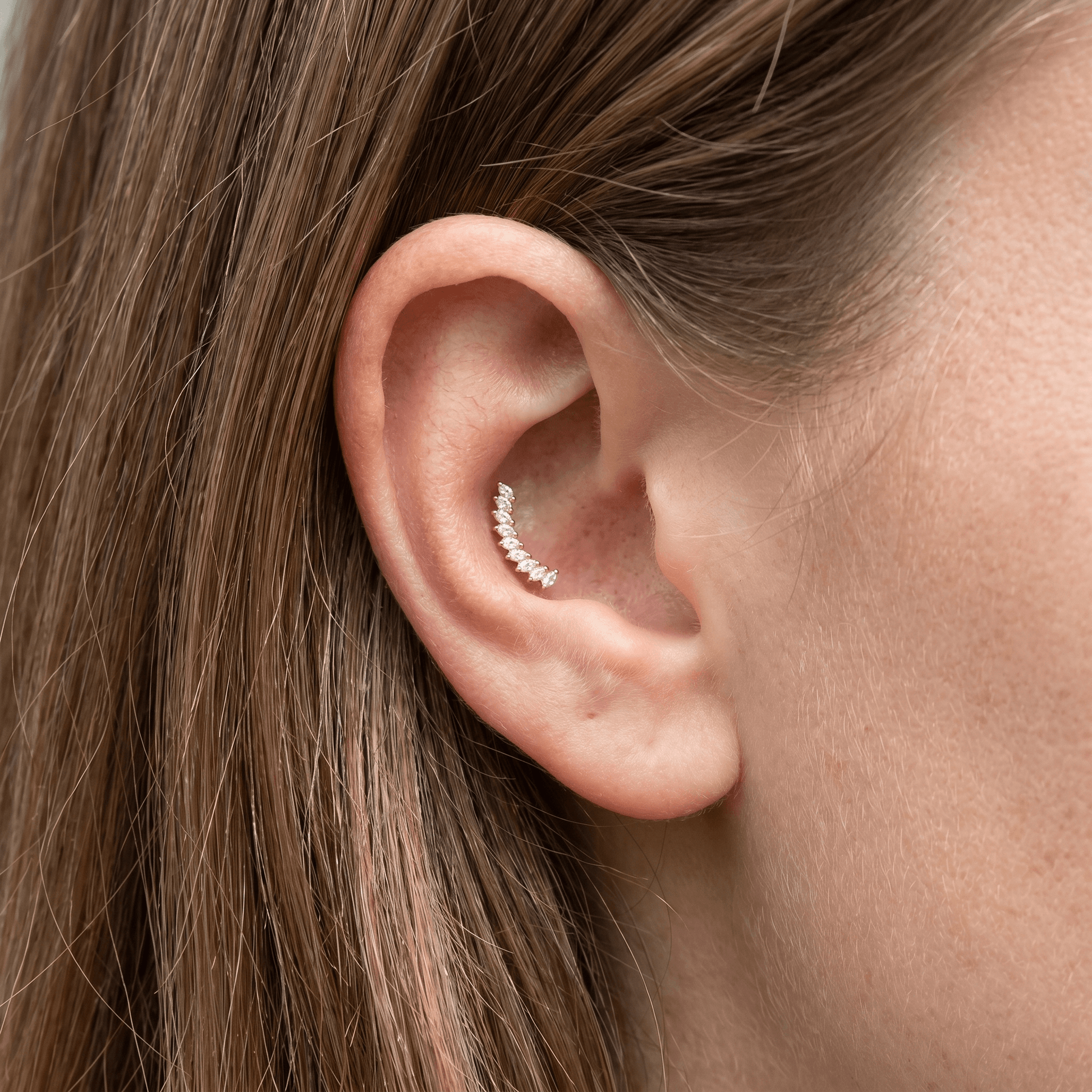 Silver crown leaf zircon stud — outer conch piercing placement