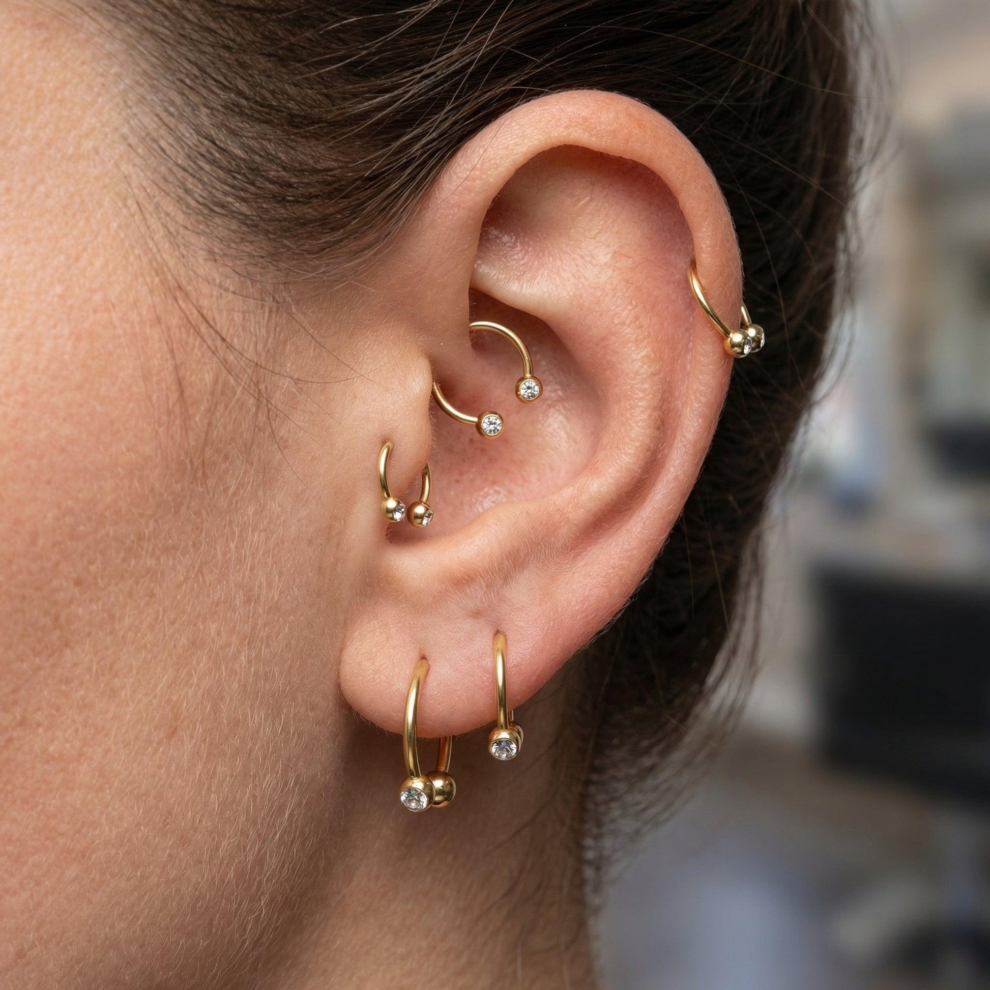 Crystal Piercing In Septum - Multiple gold titanium horseshoe