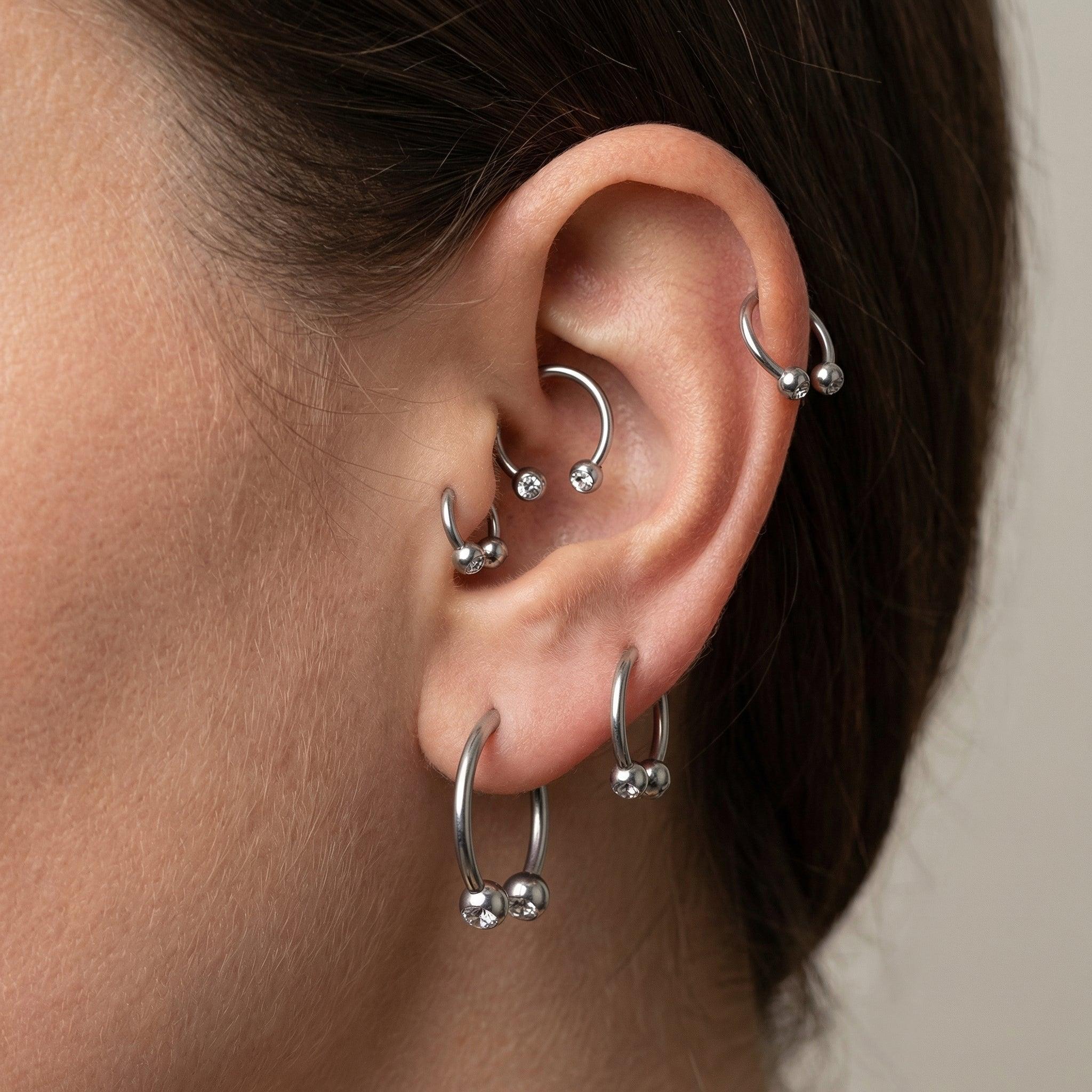 Crystal Piercing In Septum - Multiple silver titanium horseshoe