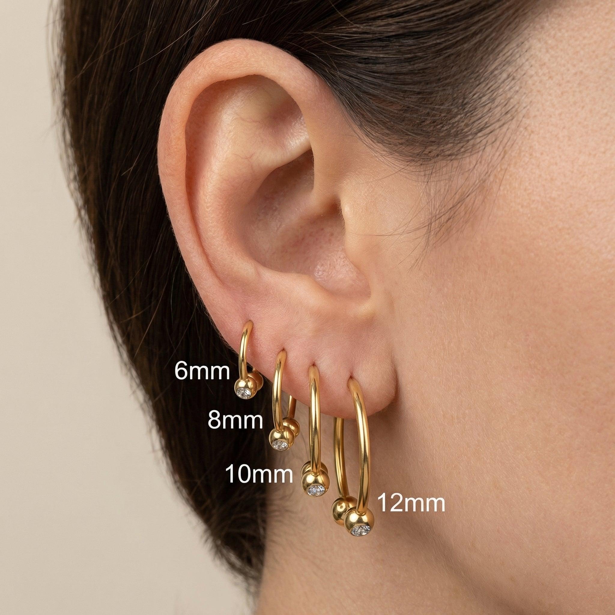 Crystal Piercing In Septum - Gold ear stack showing