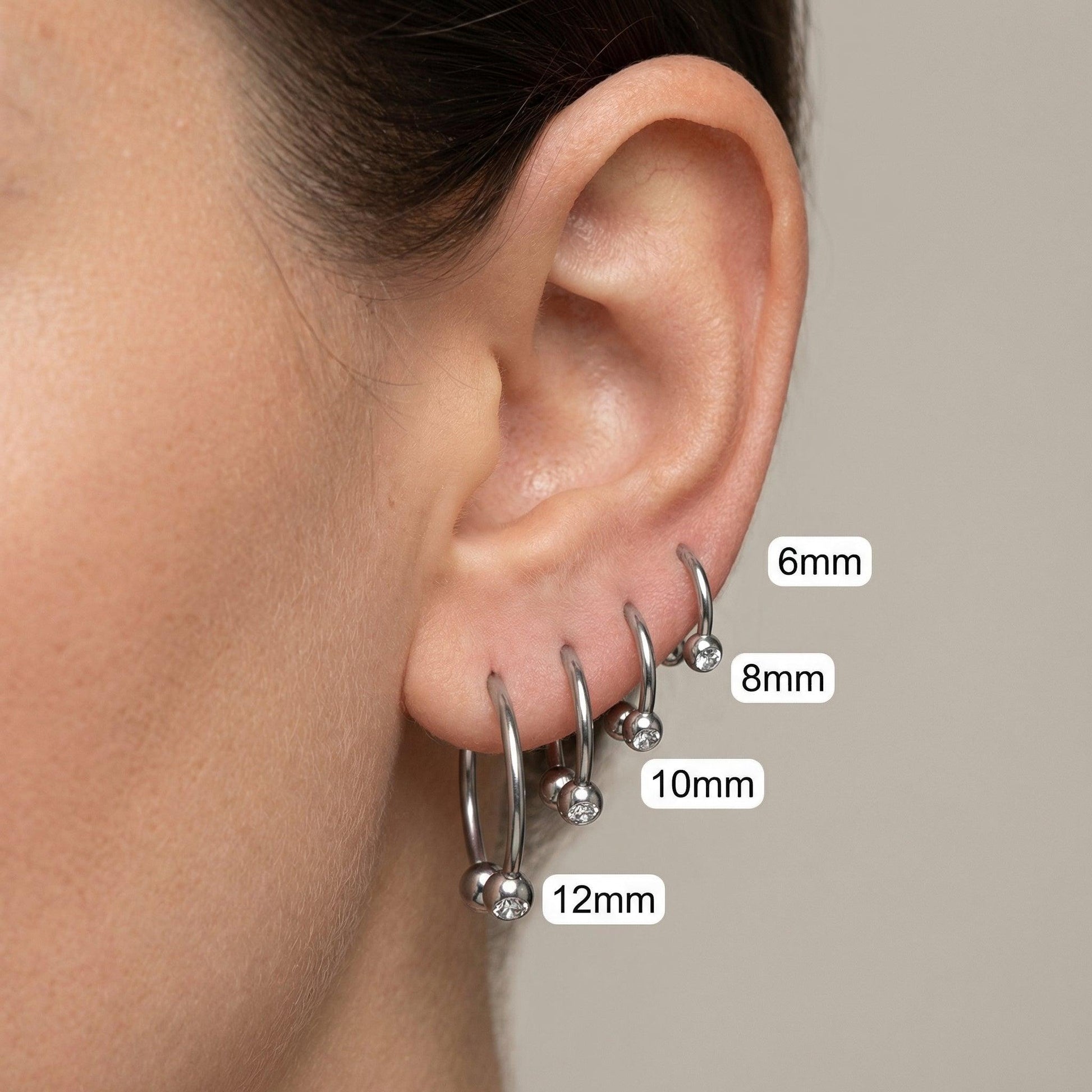 Crystal Piercing In Septum - Silver ear stack showing