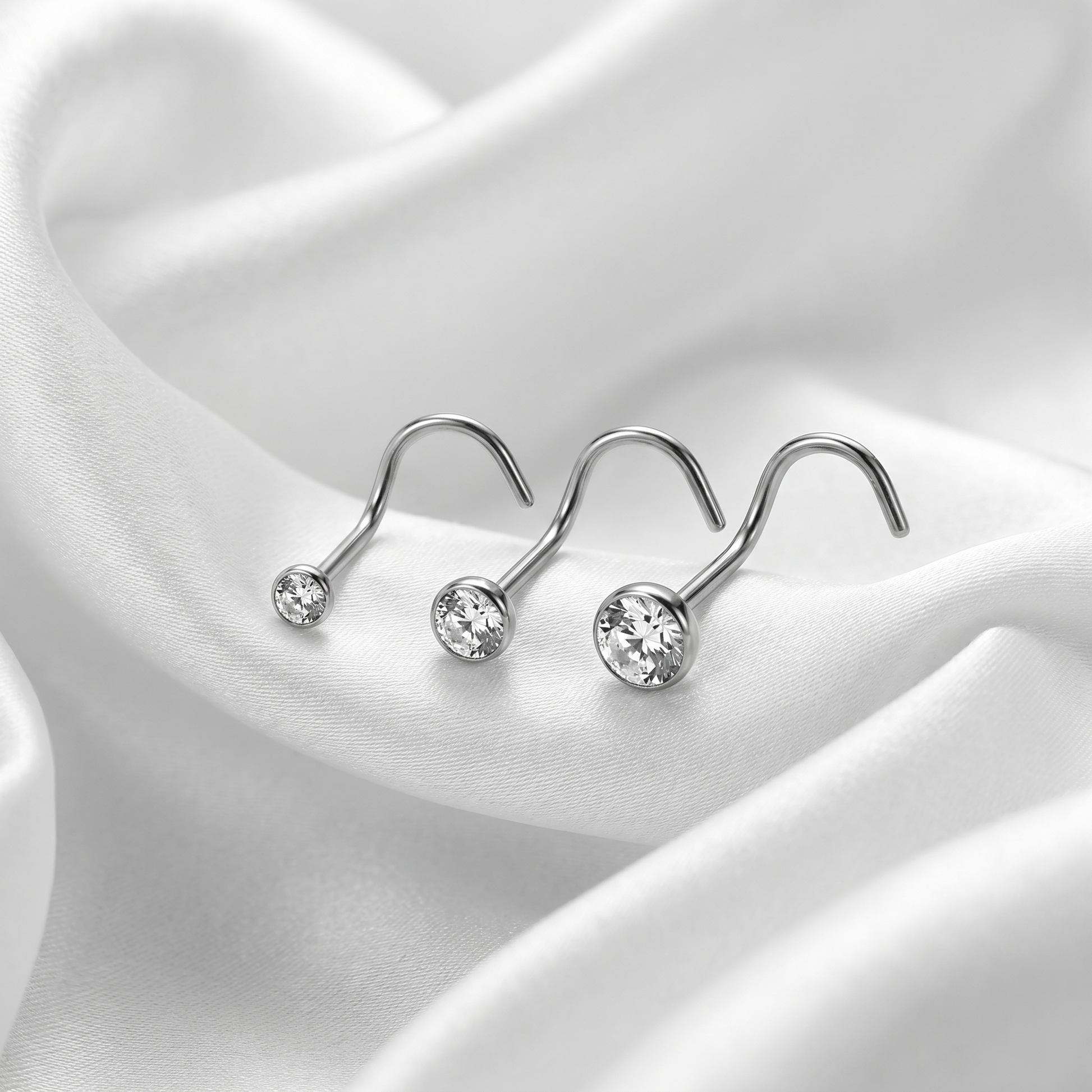 crystal nose stud sizes shown together — G23 titanium 20G