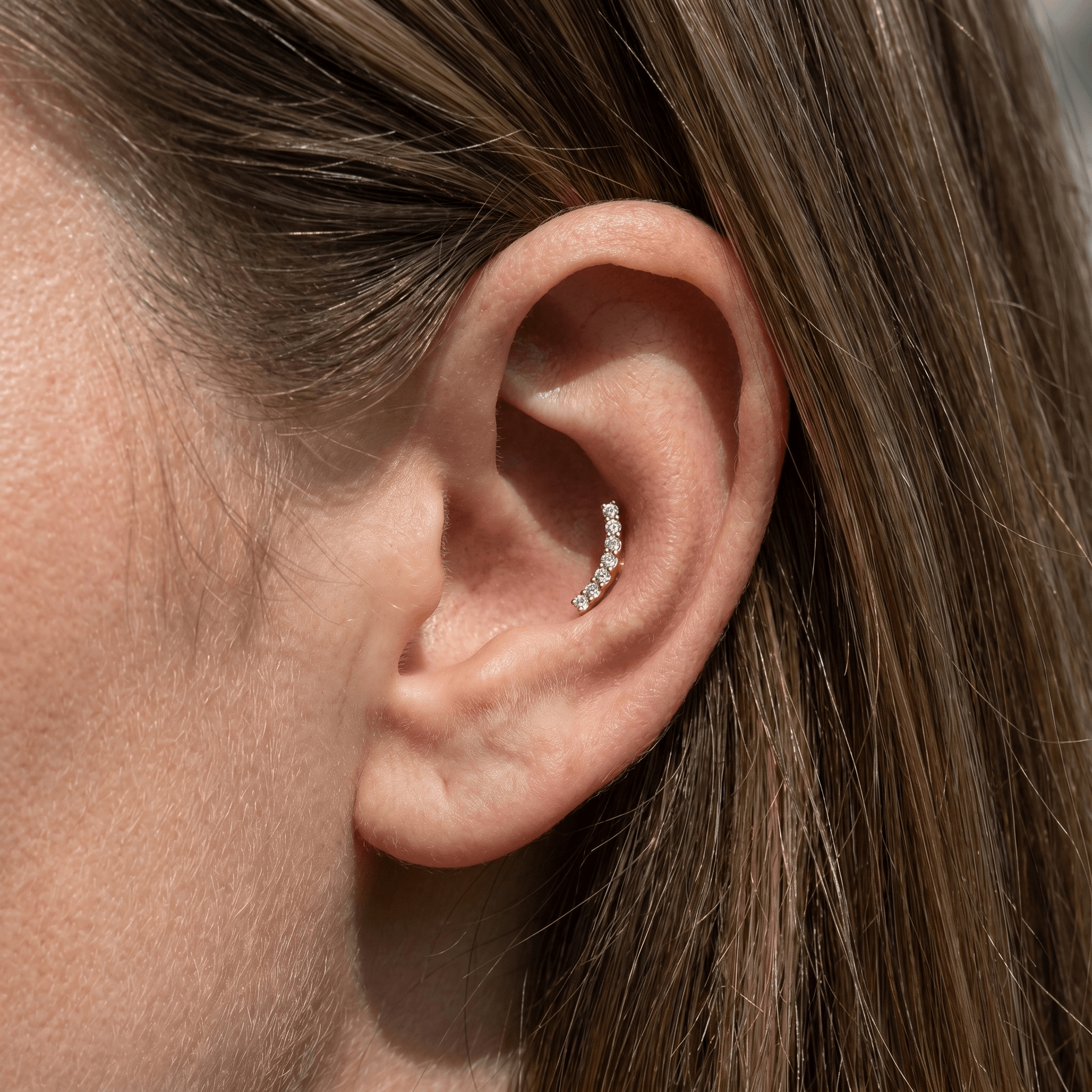 Silver curved bar zircon stud — conch jewelry placement