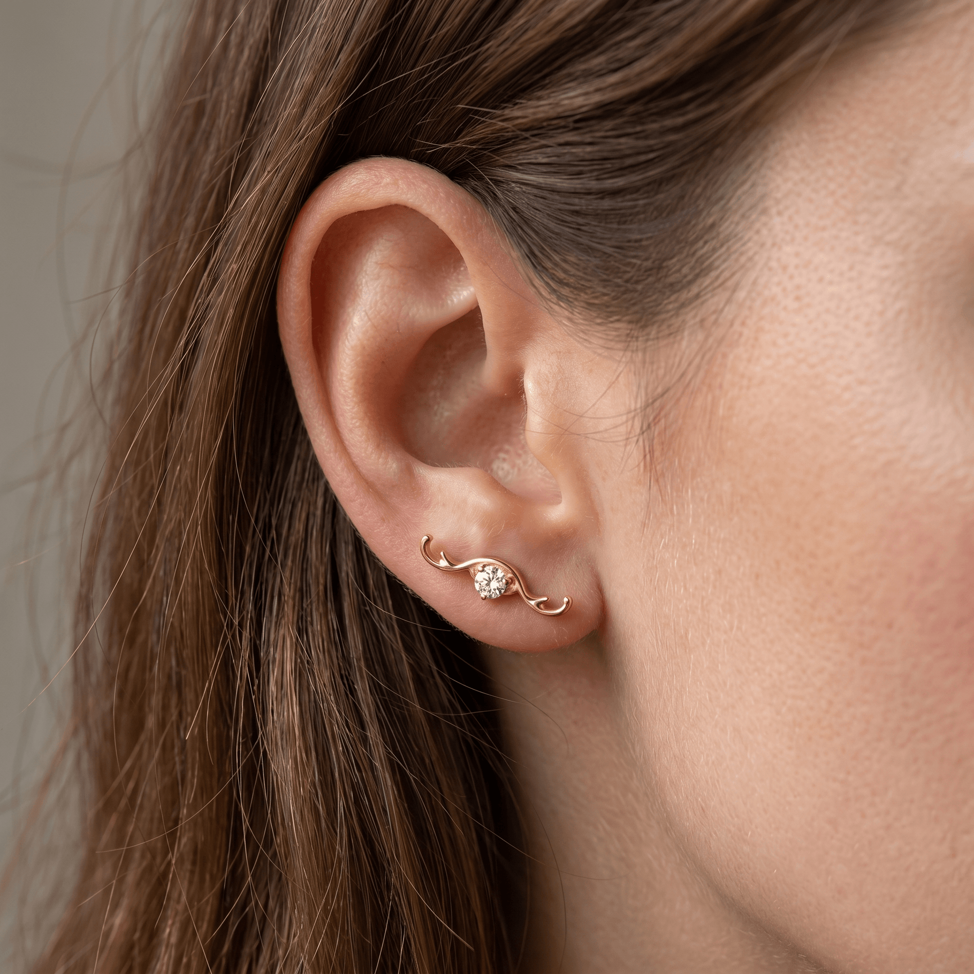 Gold medical-grade titanium piercing worn beautifully in an arrangement.