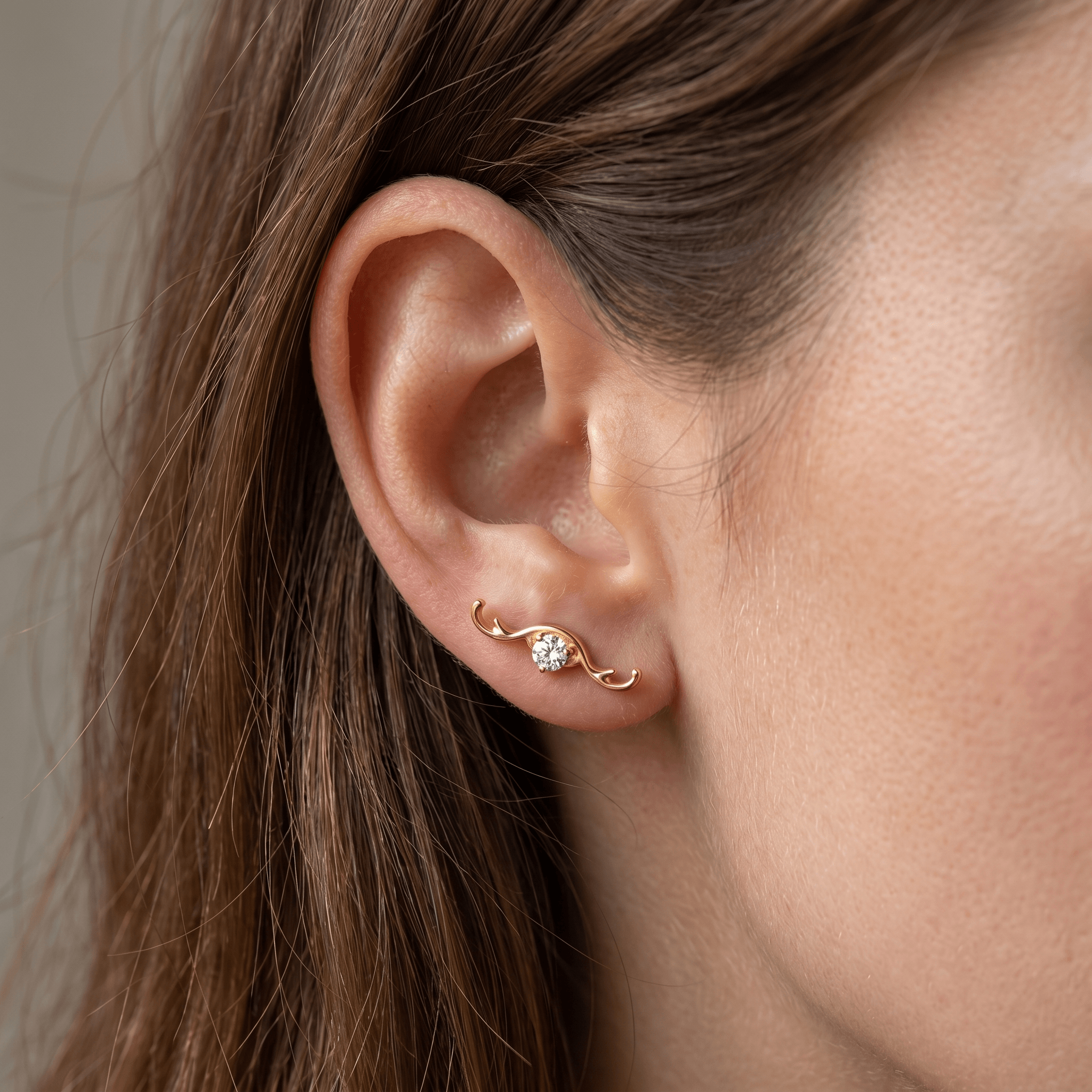 Gold medical-grade titanium piercing worn beautifully in an arrangement.