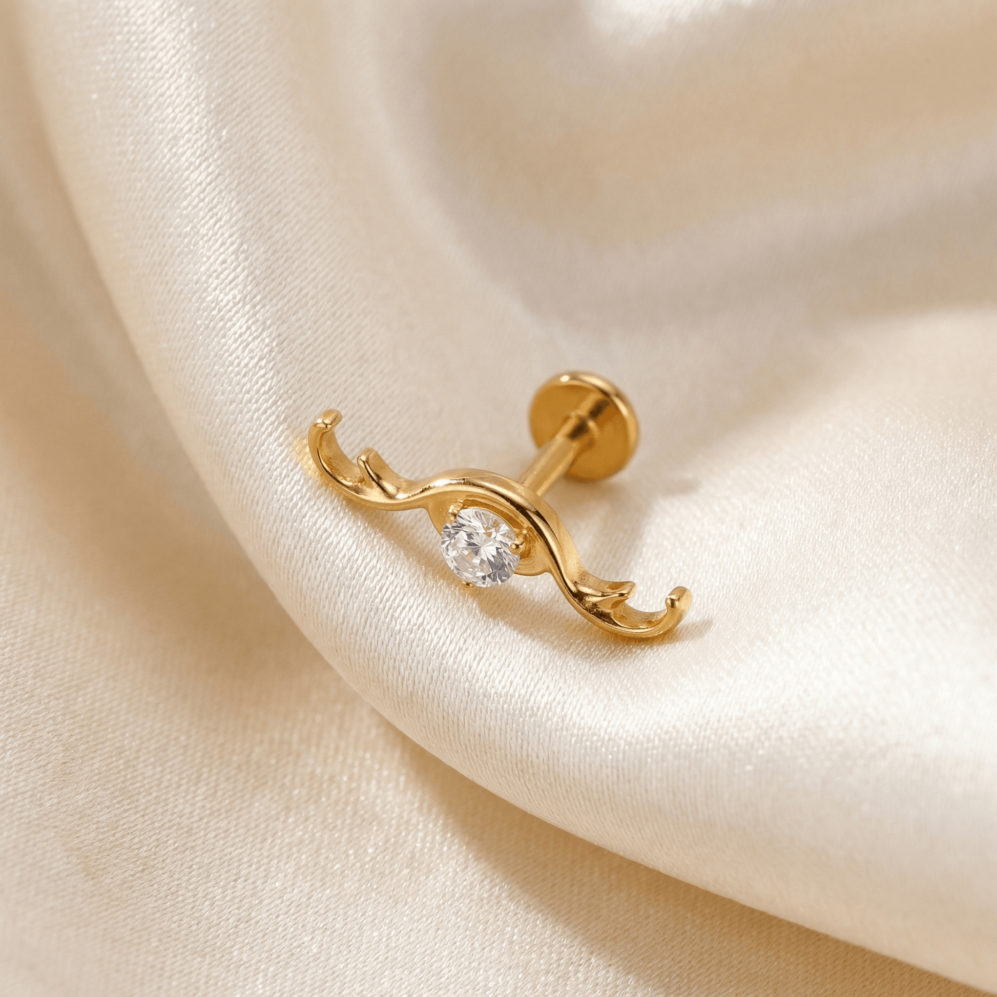 Curved Hidden Helix Piercing - Gold titanium resting gracefully