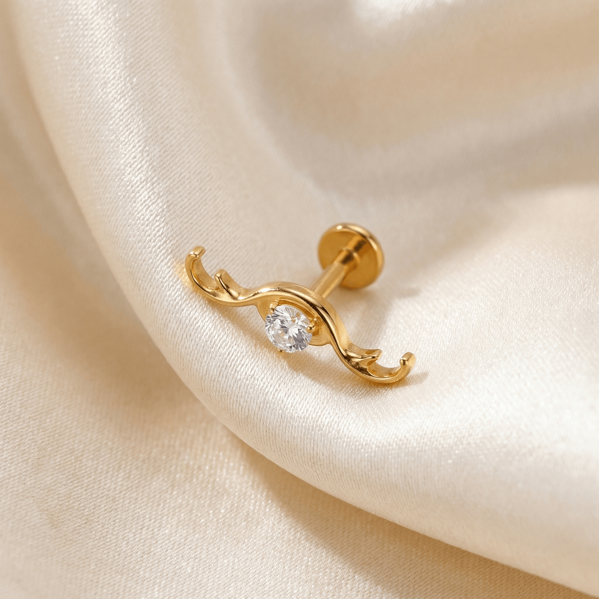 Curved Hidden Helix Piercing - Gold titanium resting gracefully