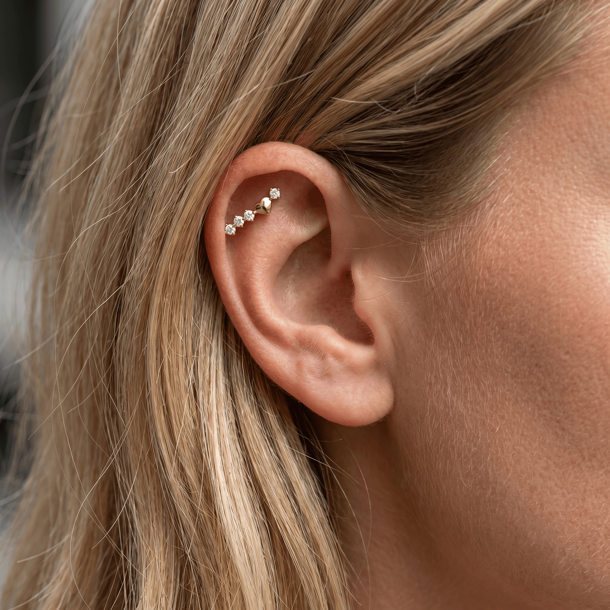 Gold curved zircon stud — flat helix piercing placement