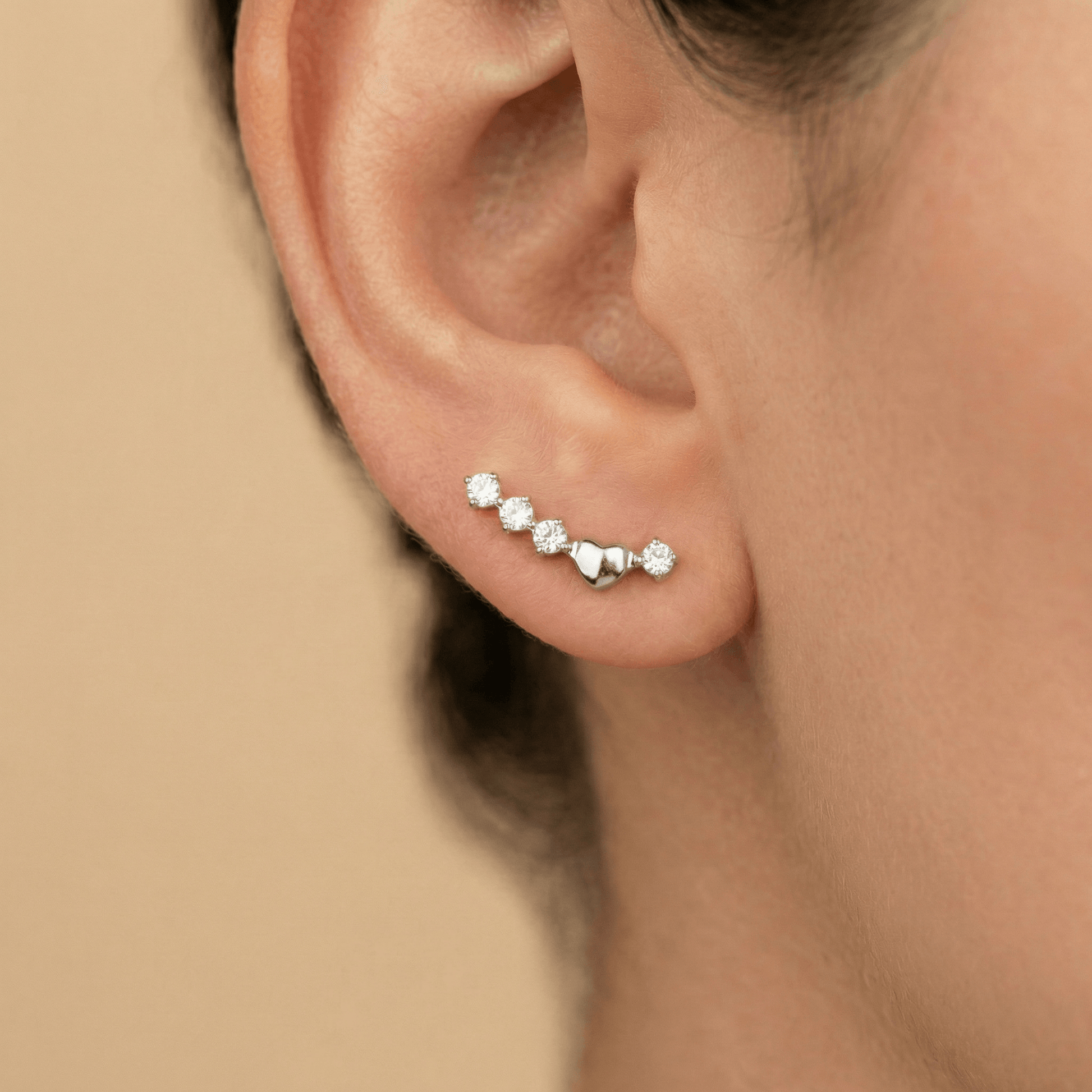 Close-up of a silver titanium curved zircon piercing stud worn beautifully in