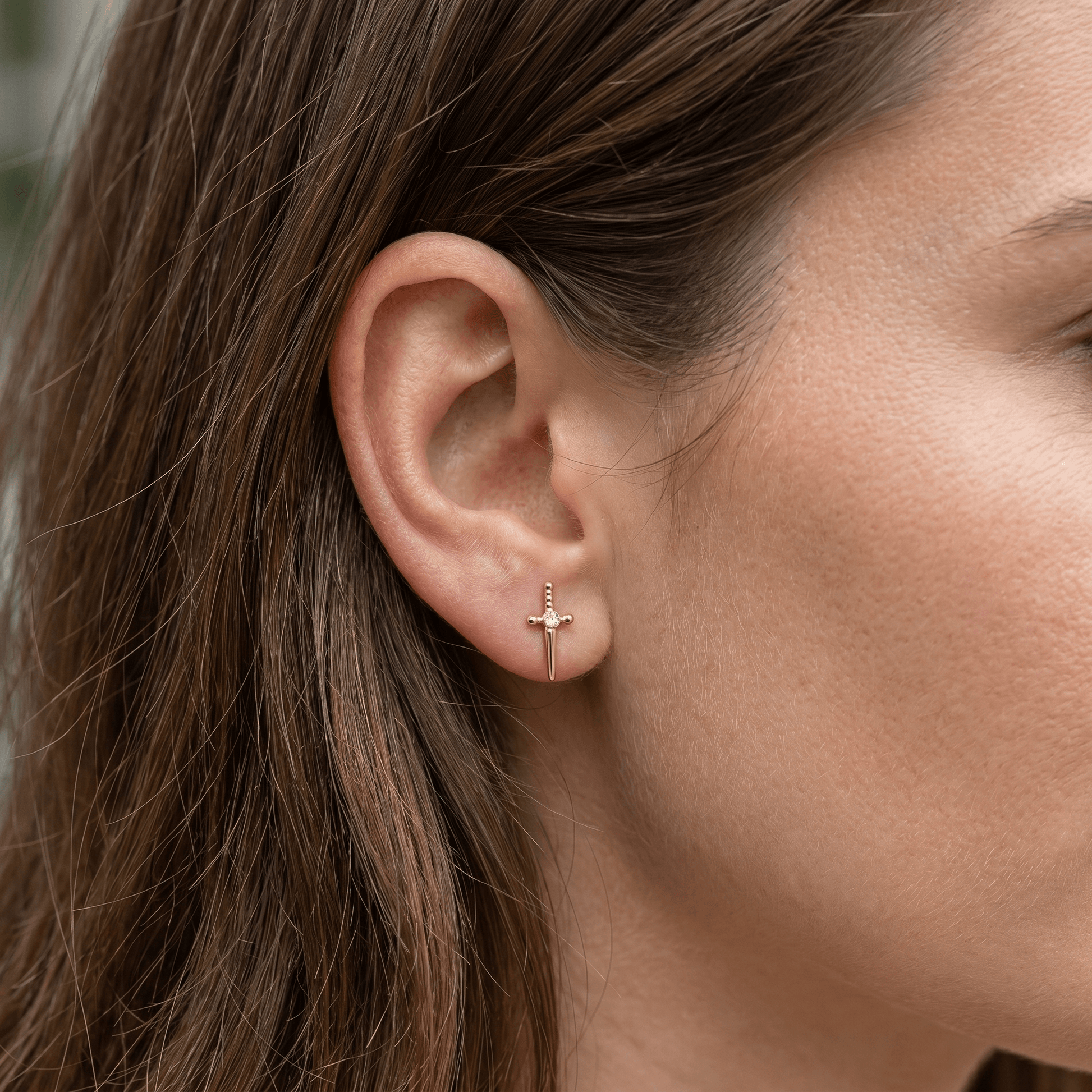 Gold medical-grade titanium stud styled perfectly in a standard .