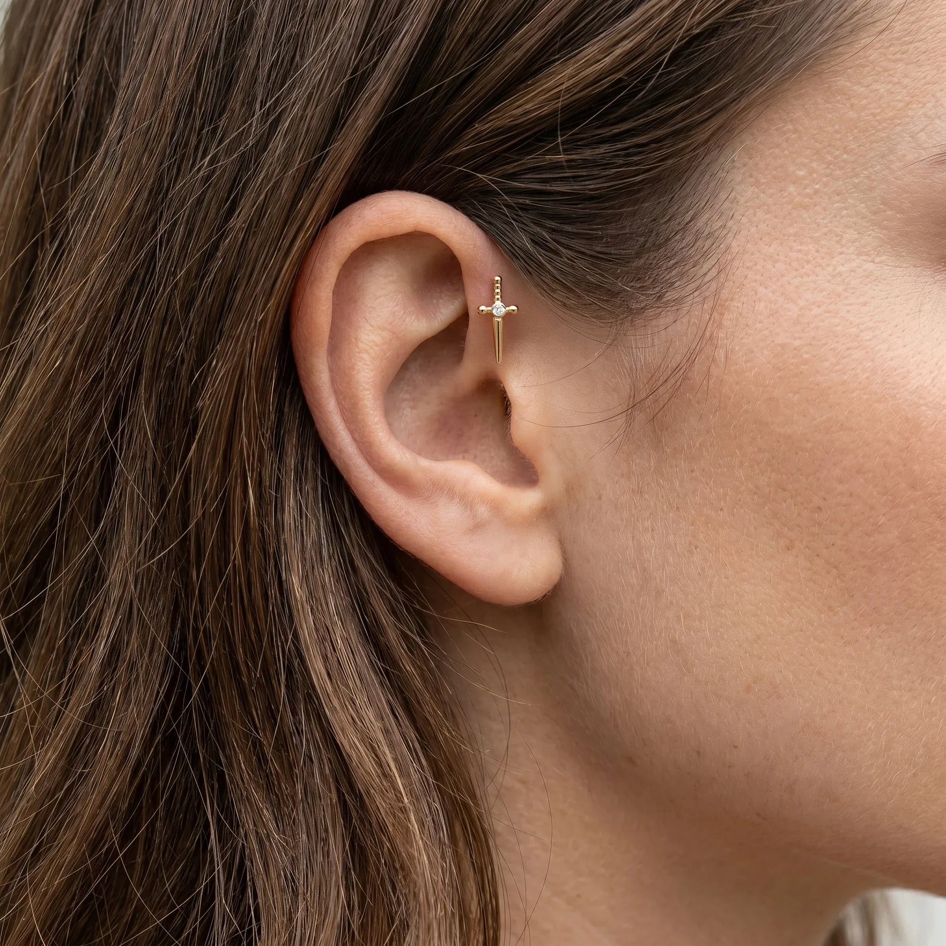 Dagger Front Helix Piercing - Gold titanium worn in