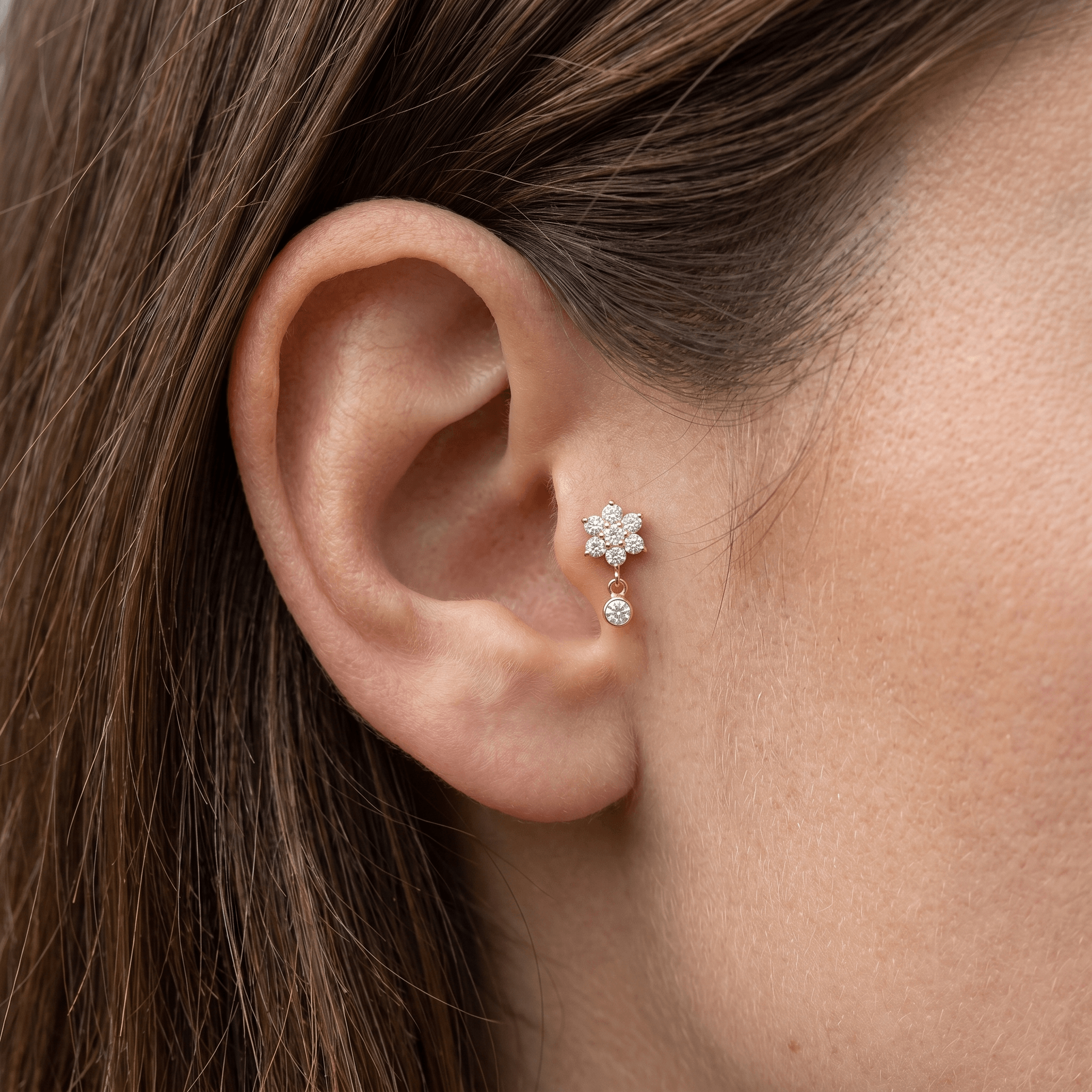 Gold hypoallergenic ear stack jewelry styled in a piercing.