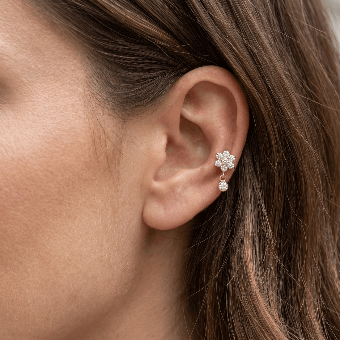 Gold daisy dangle stud — mid helix piercing placement