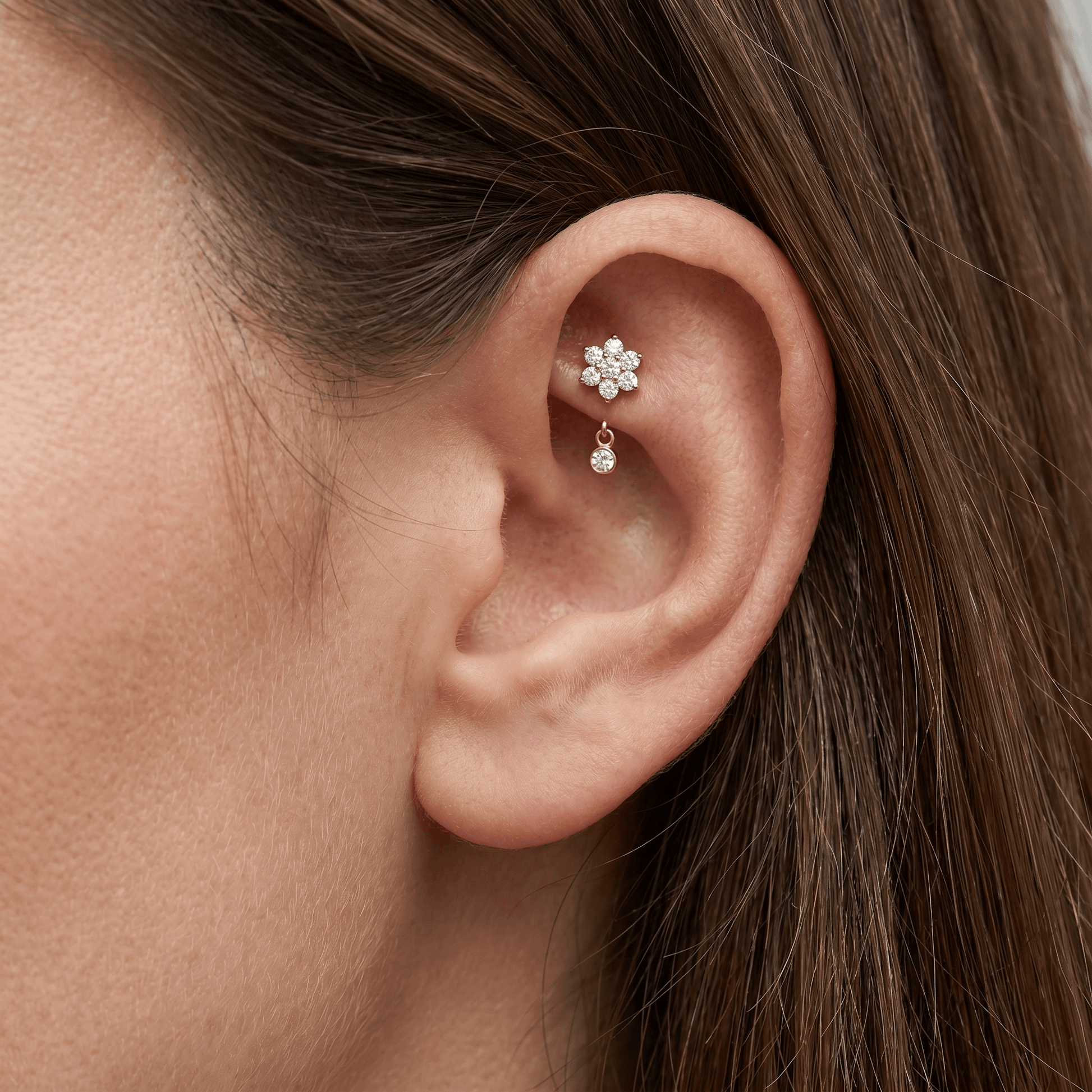 Gold daisy dangle stud — faux rook piercing placement