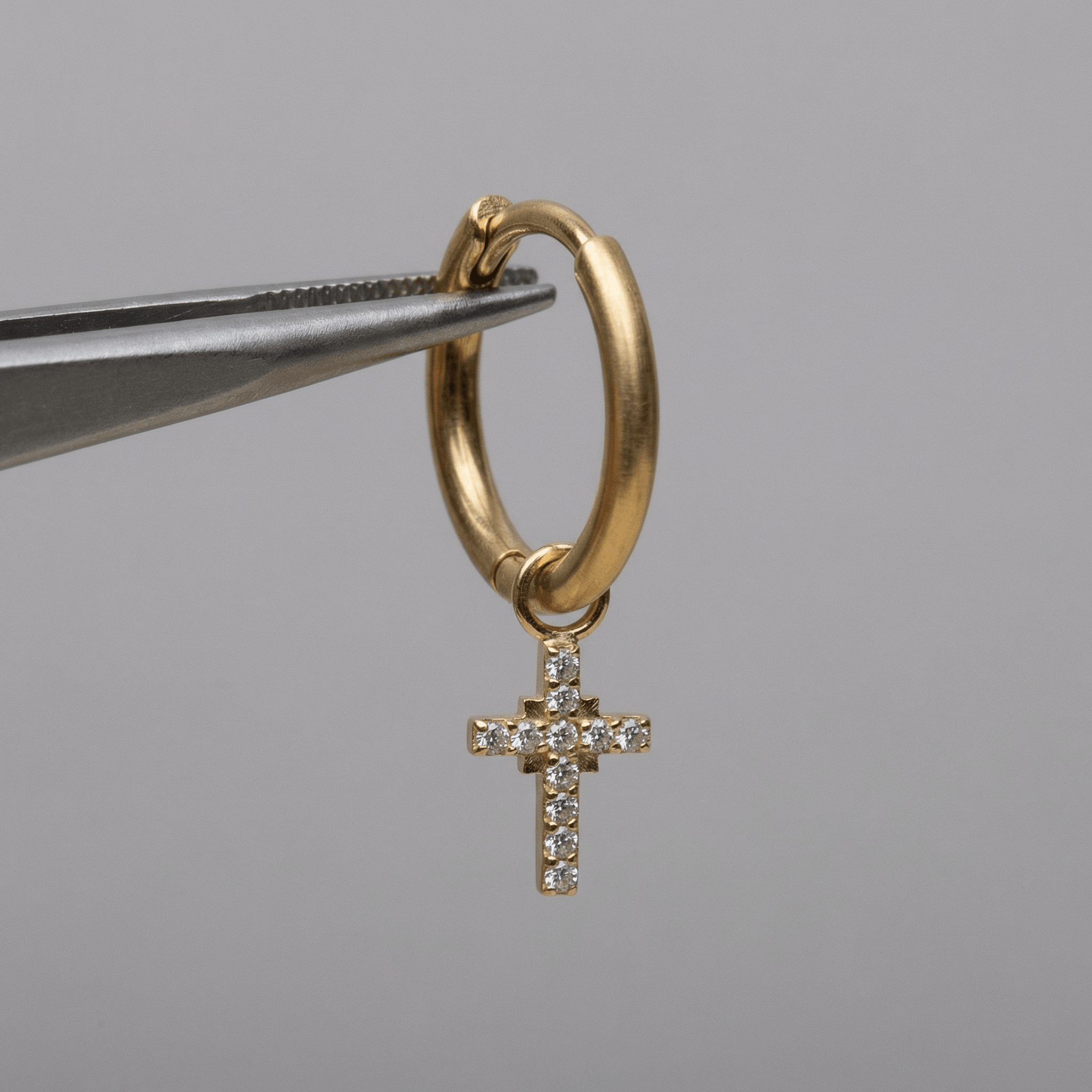 Dangling Front Helix Piercing - Gold cross charm piercing