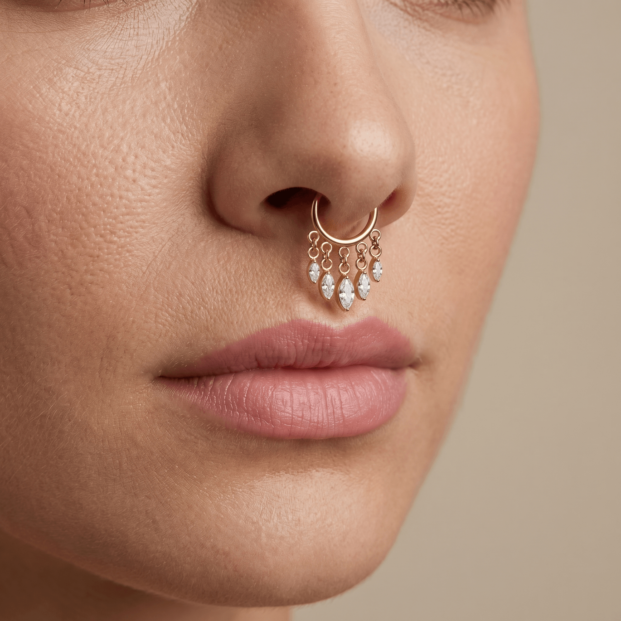 Gold dangling teardrop zircon stud — septum nose placement