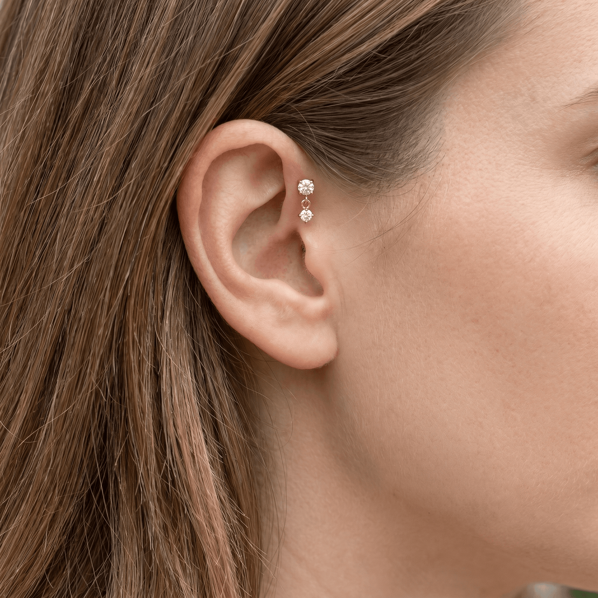 Gold double zircon drop stud — forward helix piercing placement