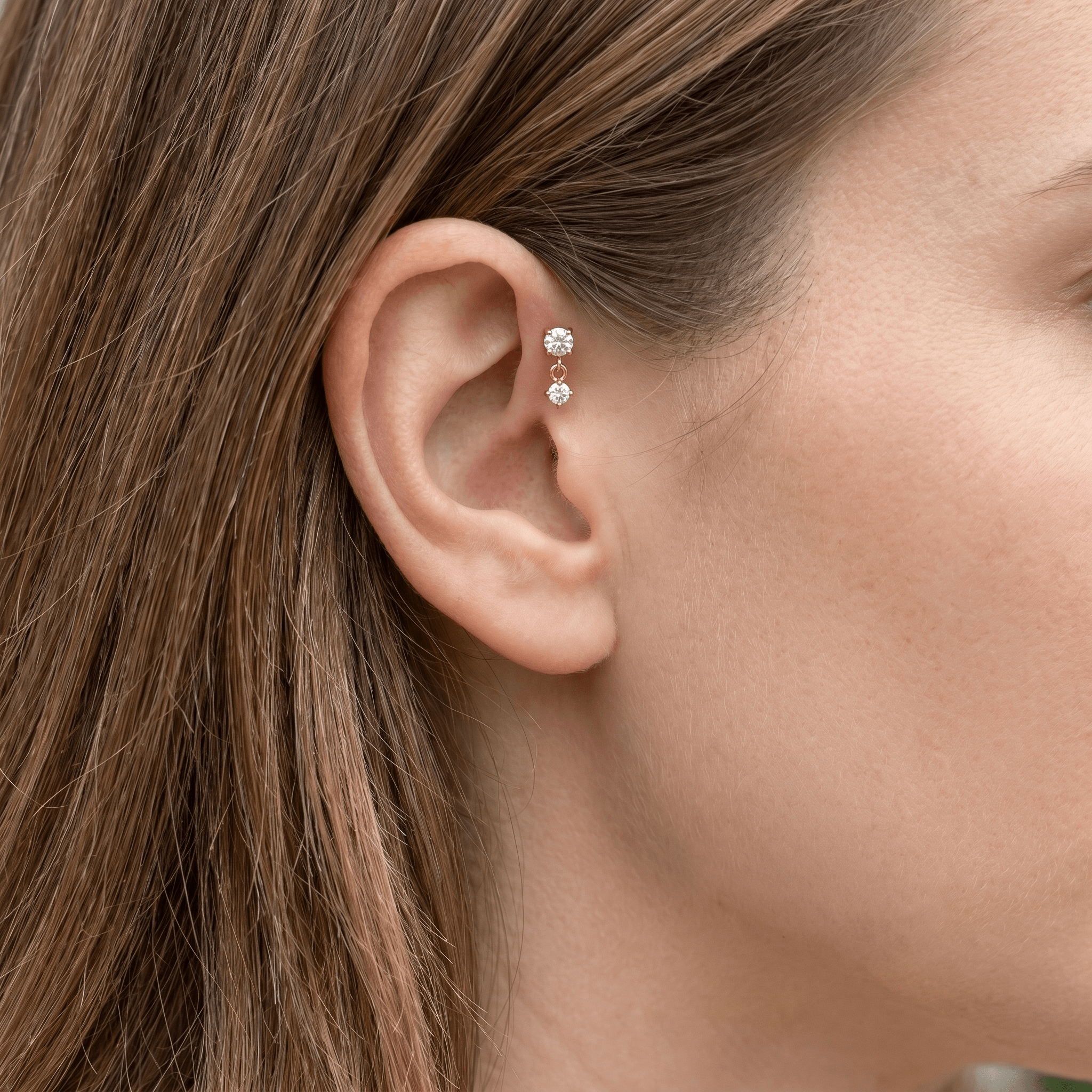 Gold double zircon drop stud — forward helix piercing placement