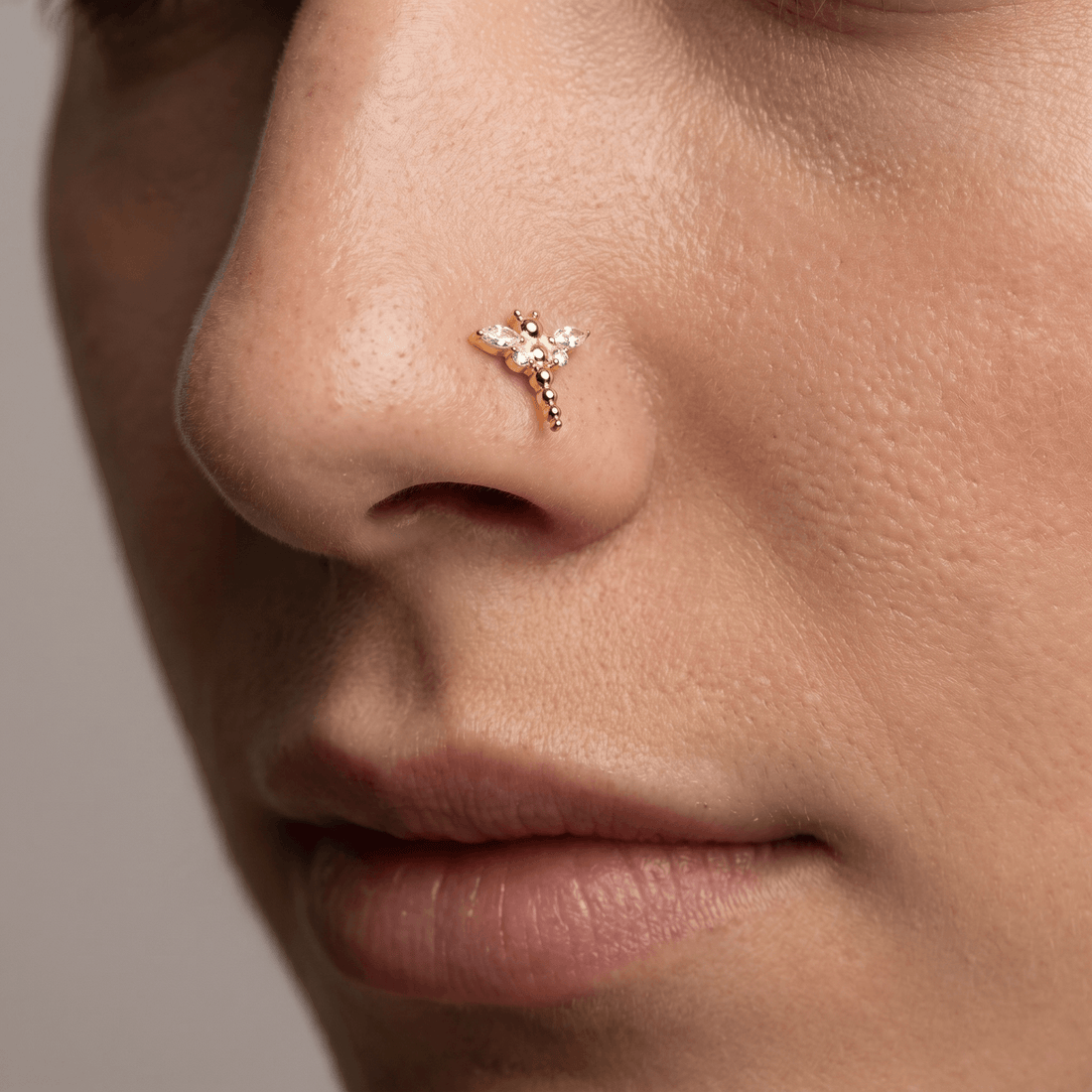 Silver dragonfly zircon stud — nose jewelry placement