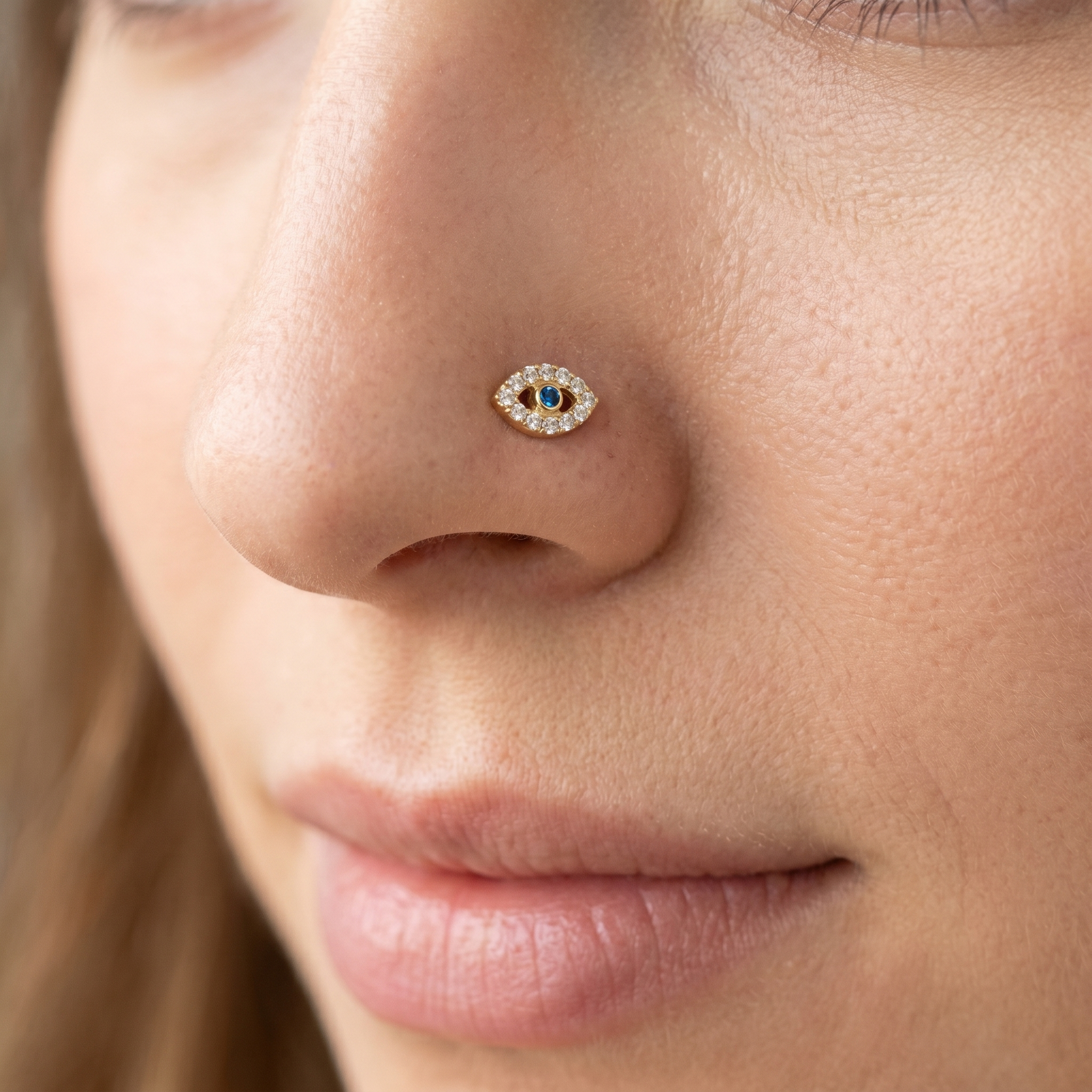 evil eye nose stud close-up on a model — single nostril nose jewelry