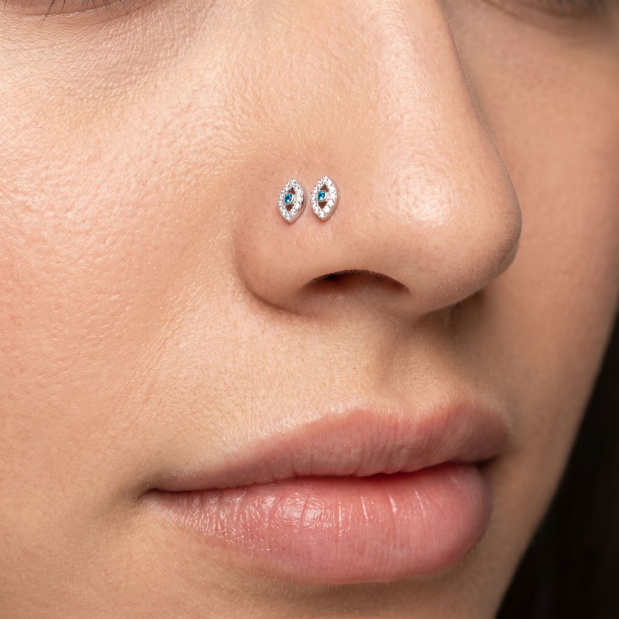 evil eye nose stud close-up, nickel-free 20G nose jewelry