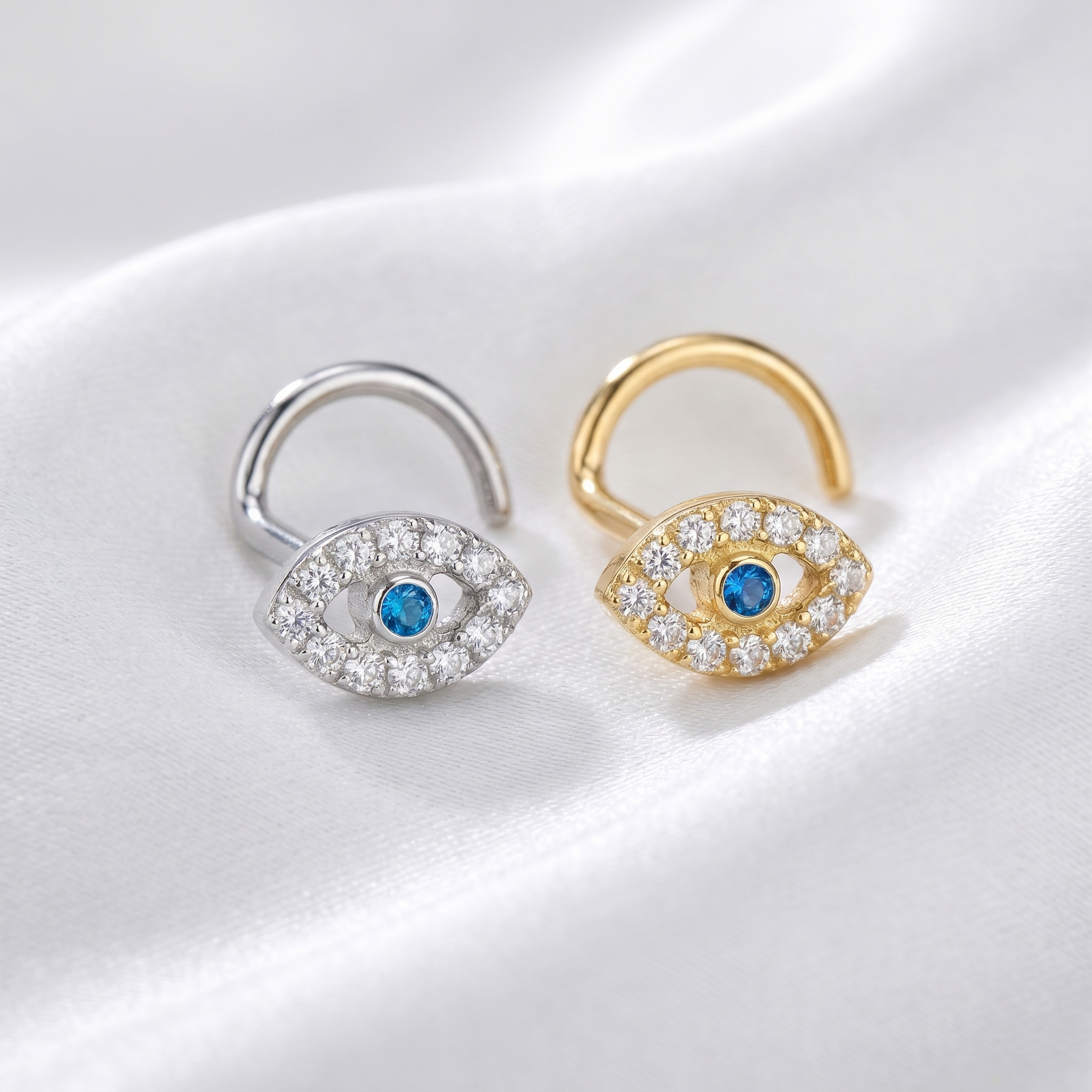 evil eye nose stud on satin, G23 implant-grade titanium