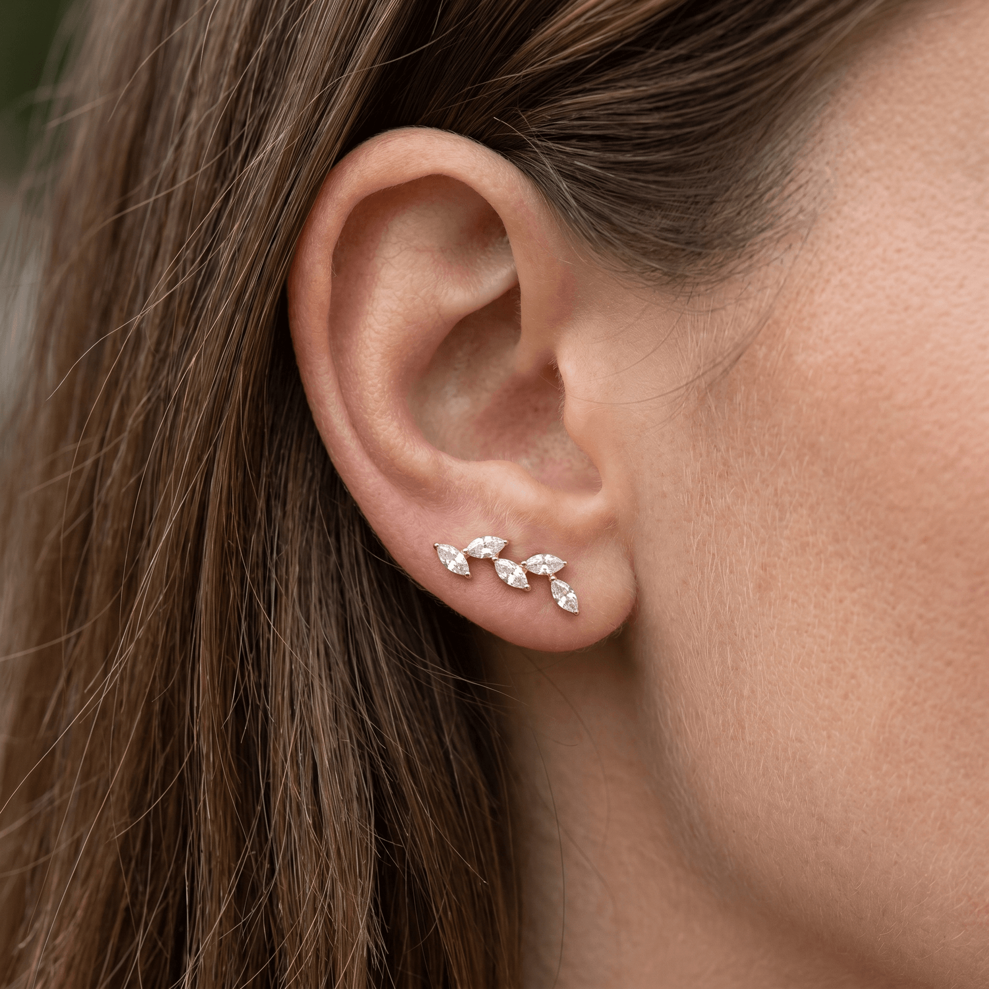 Gold five marquise jewelry styled gracefully along the .
