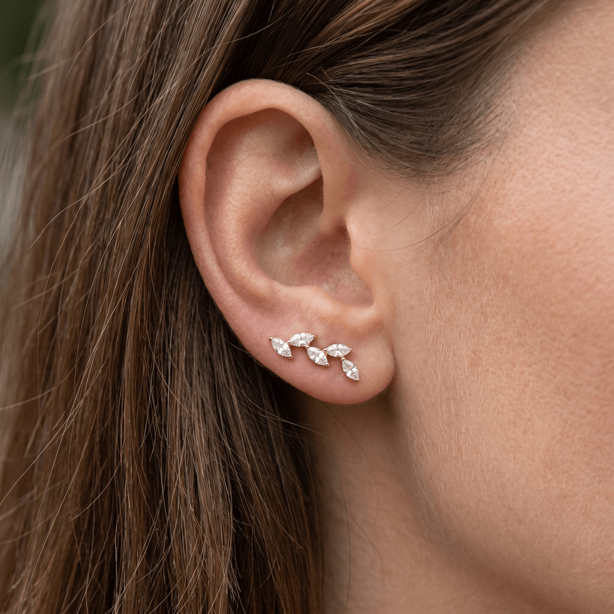 Gold five marquise jewelry styled gracefully along the .