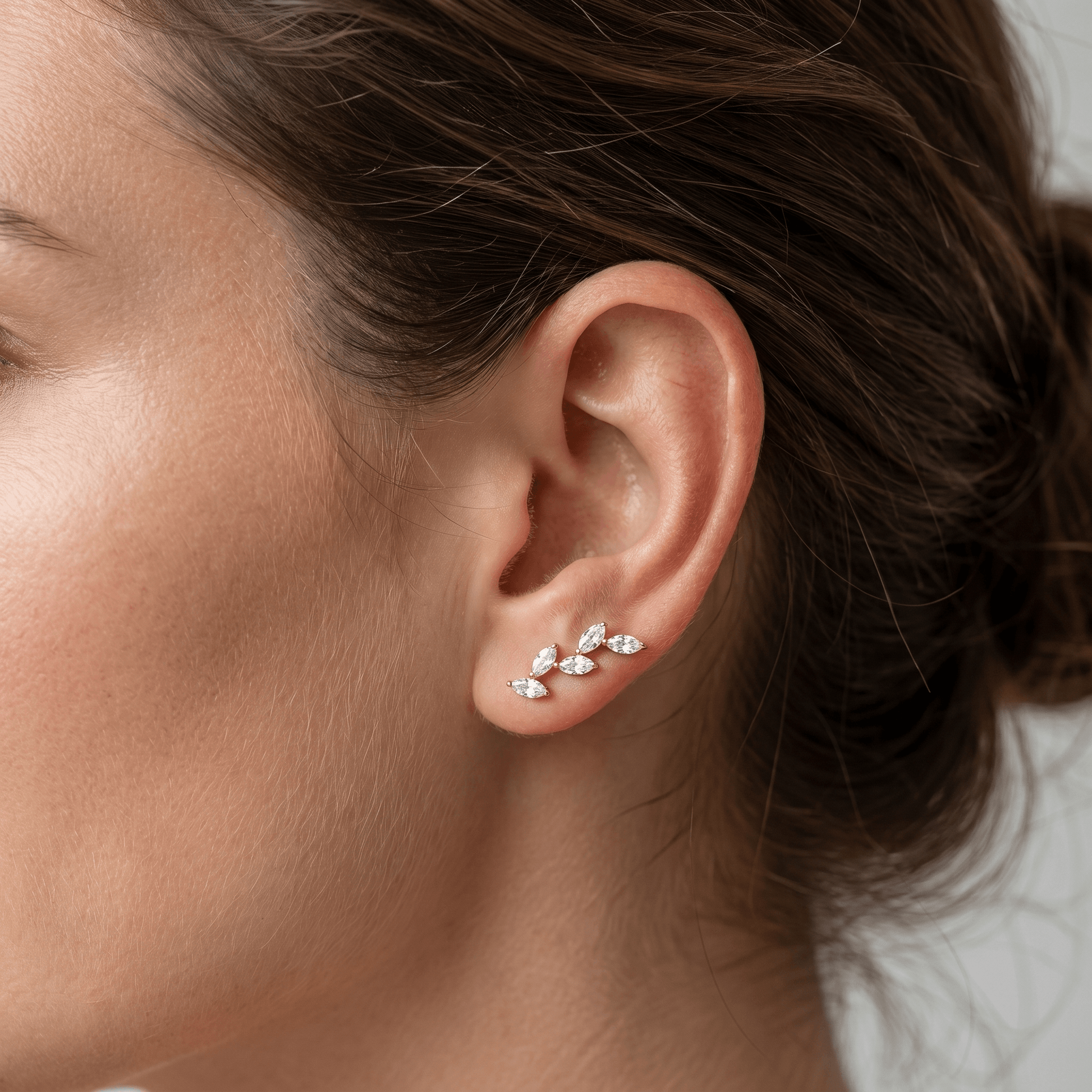 Silver marquise cluster stud worn elegantly as an climber.