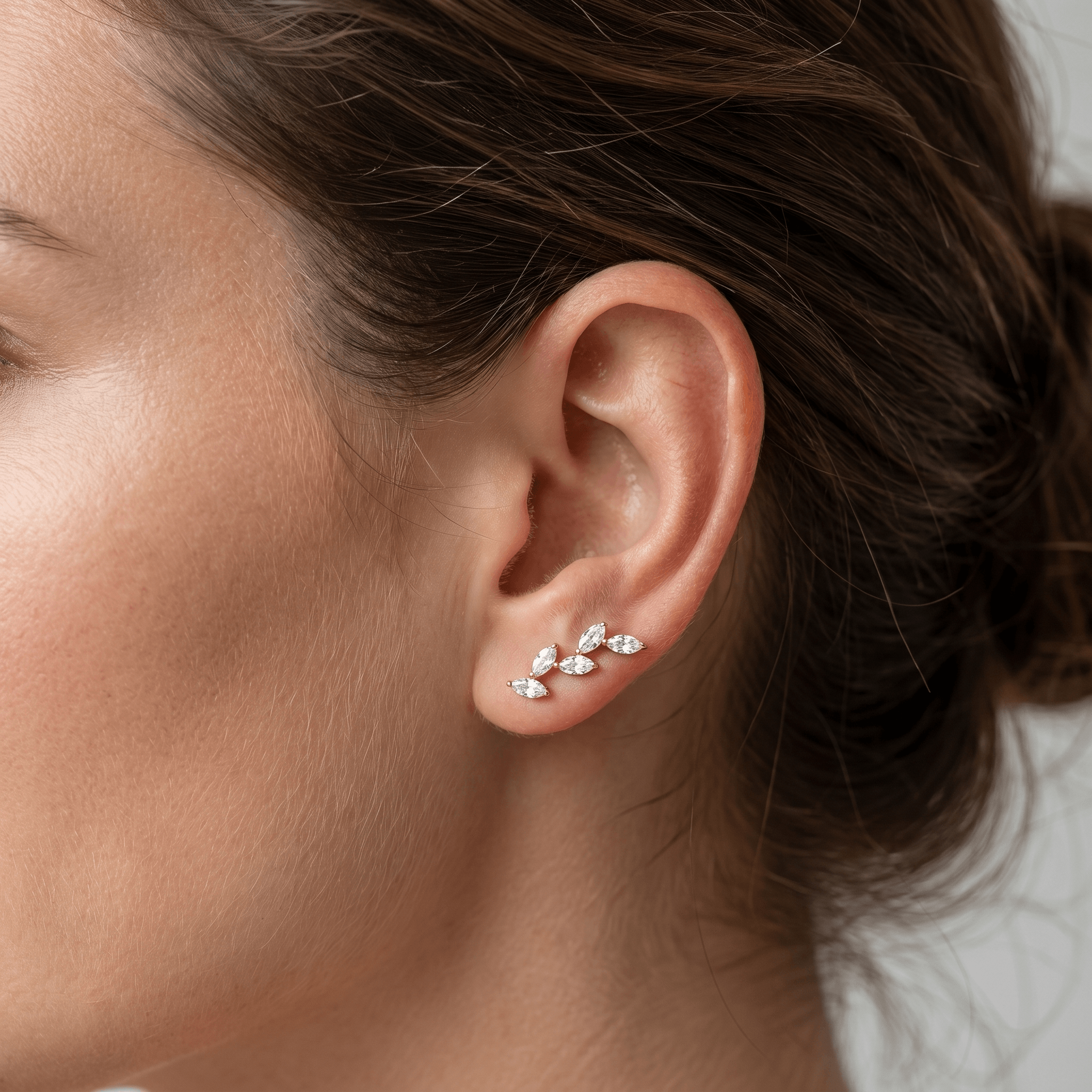 Silver marquise cluster stud worn elegantly as an climber.