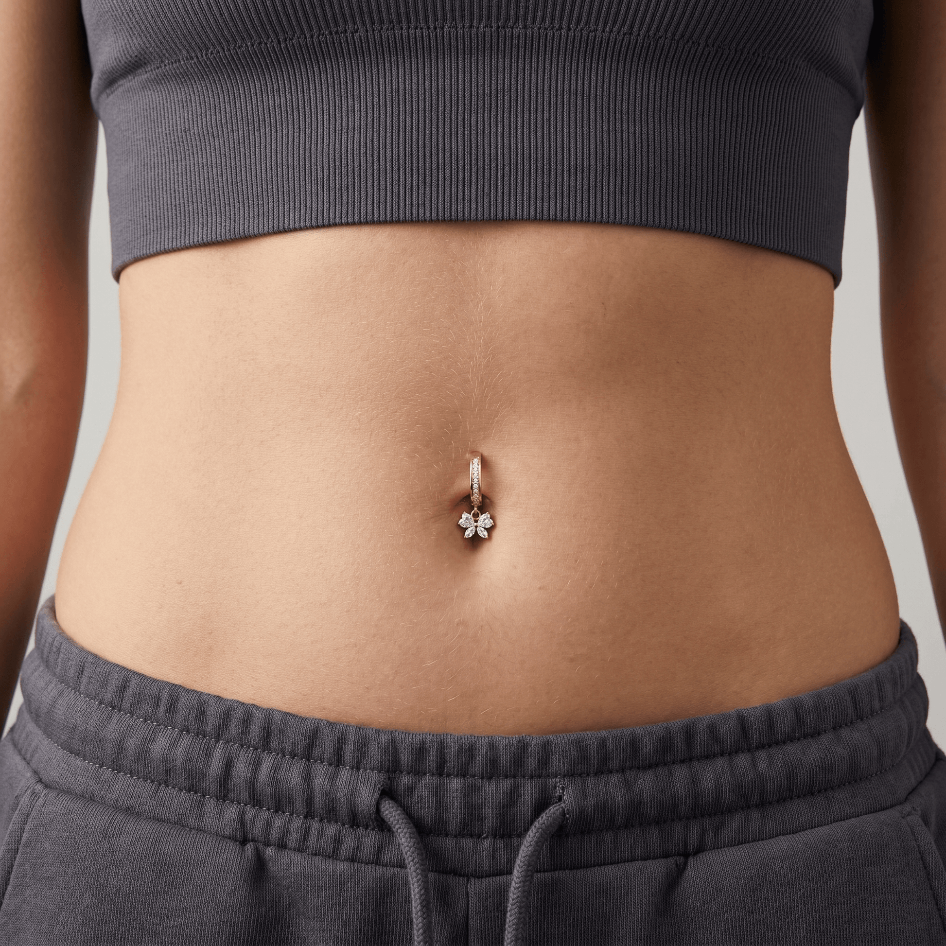 Flower Body Piercing Navel - Model wearing minimal flower